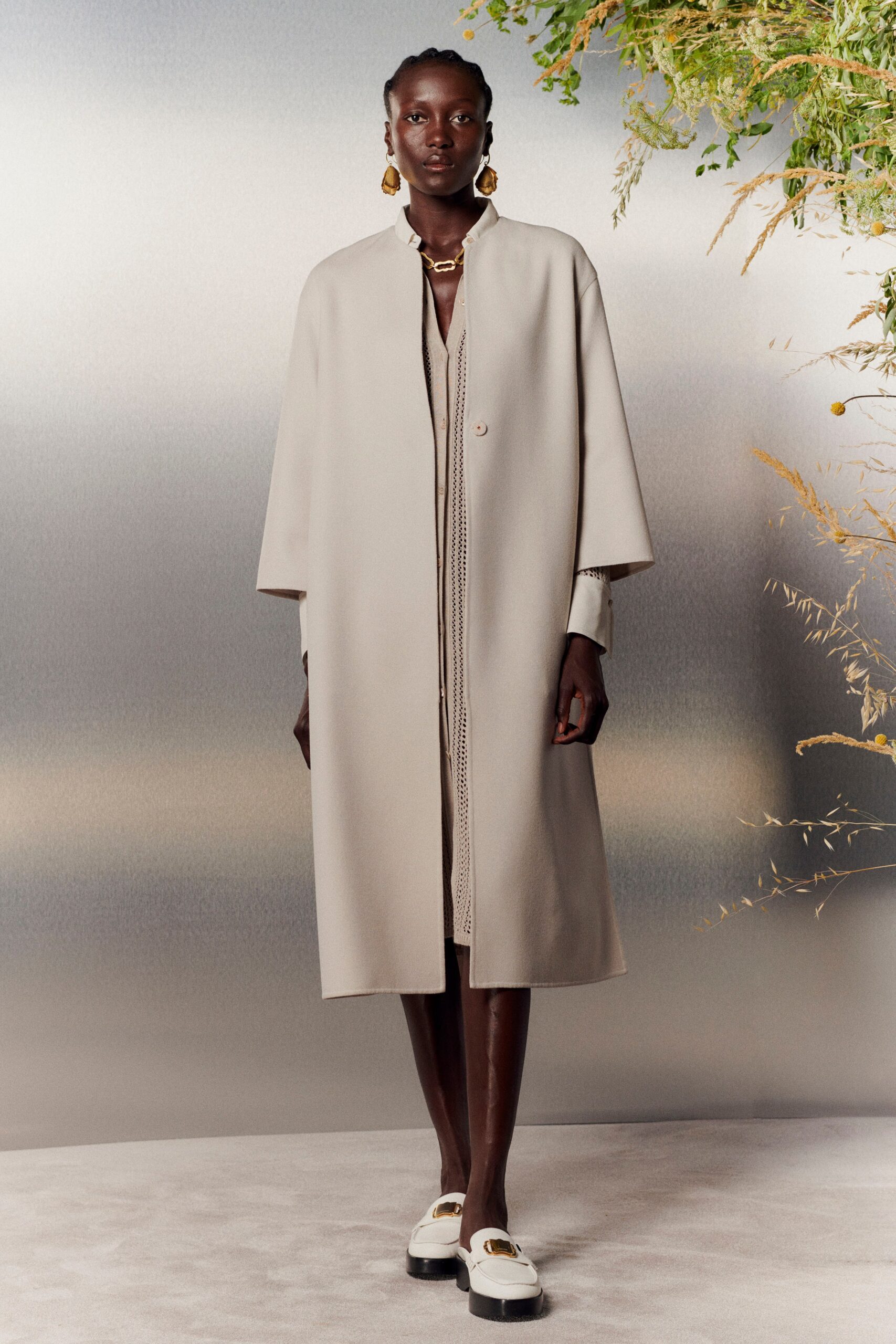 beige wool coat over white dress