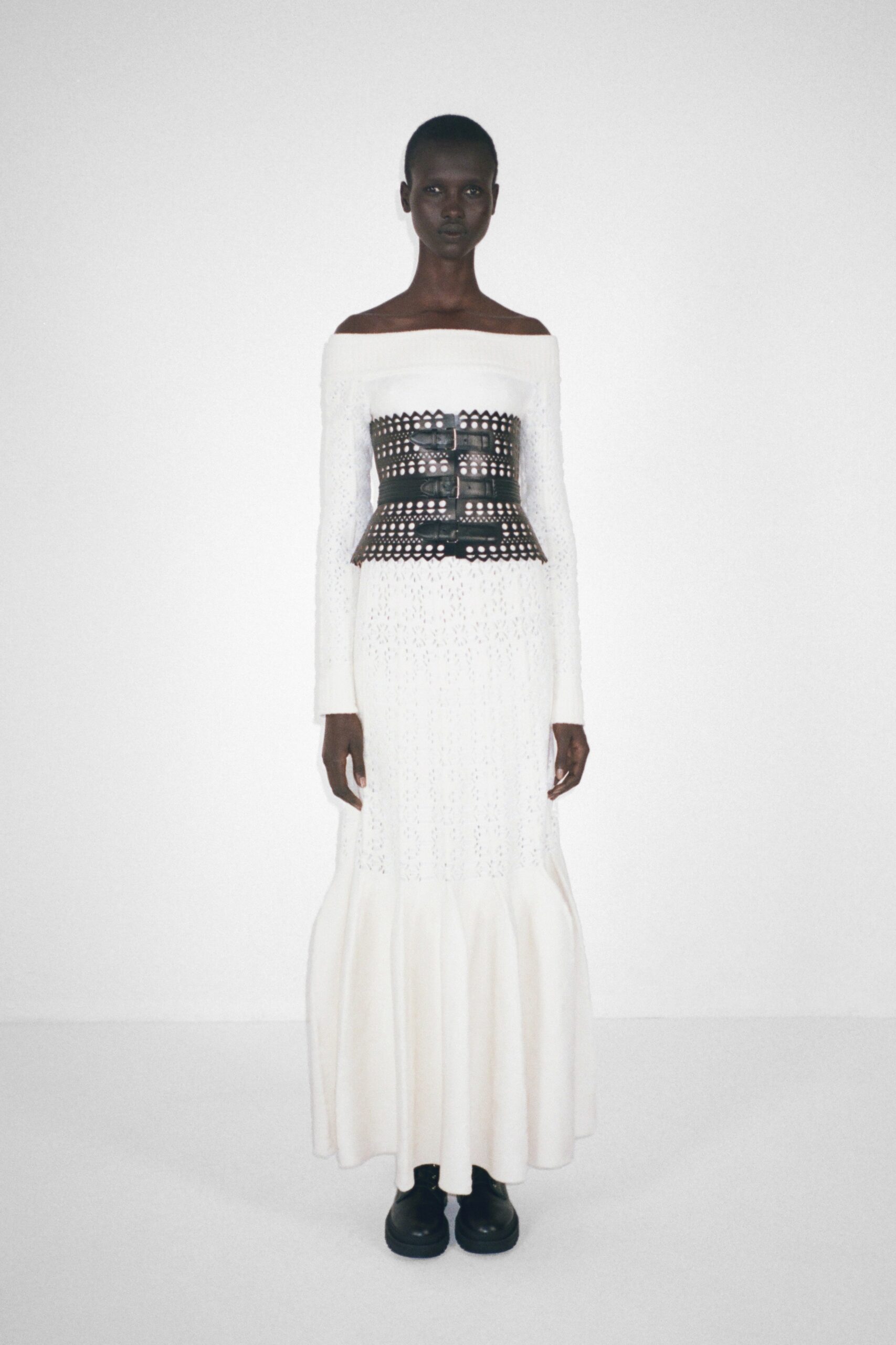 white off-shoulder gown with black corset