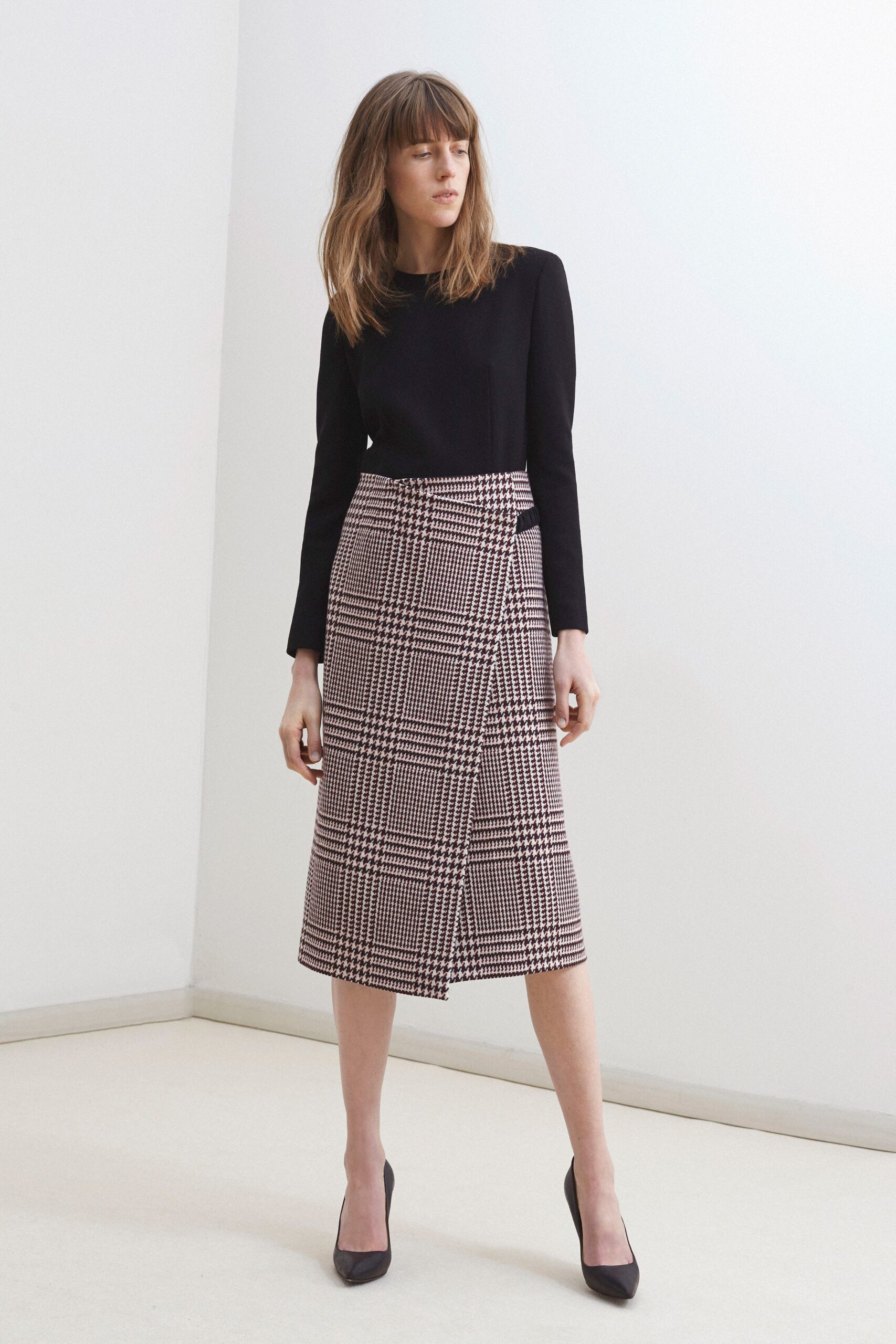 black long-sleeve collared fitted top