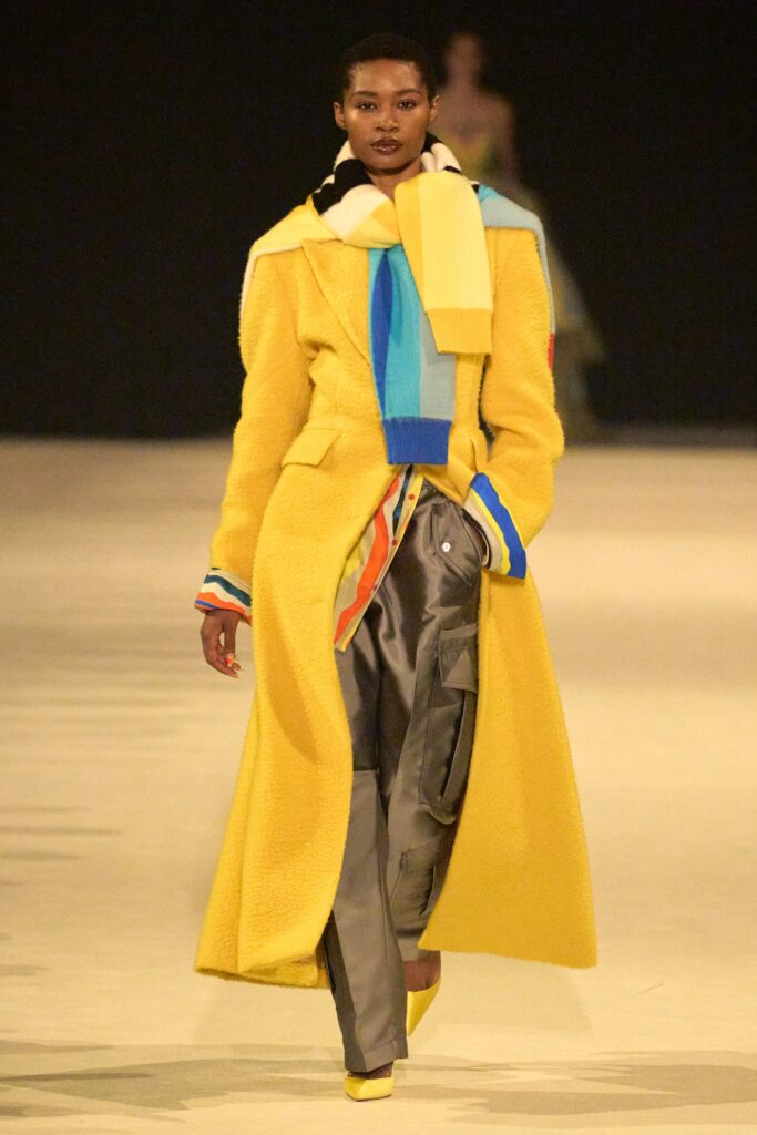 yellow wool coat with gray pants