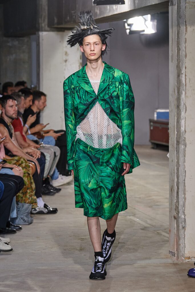 A relaxed green printed suit with long sleeves and a collared design.