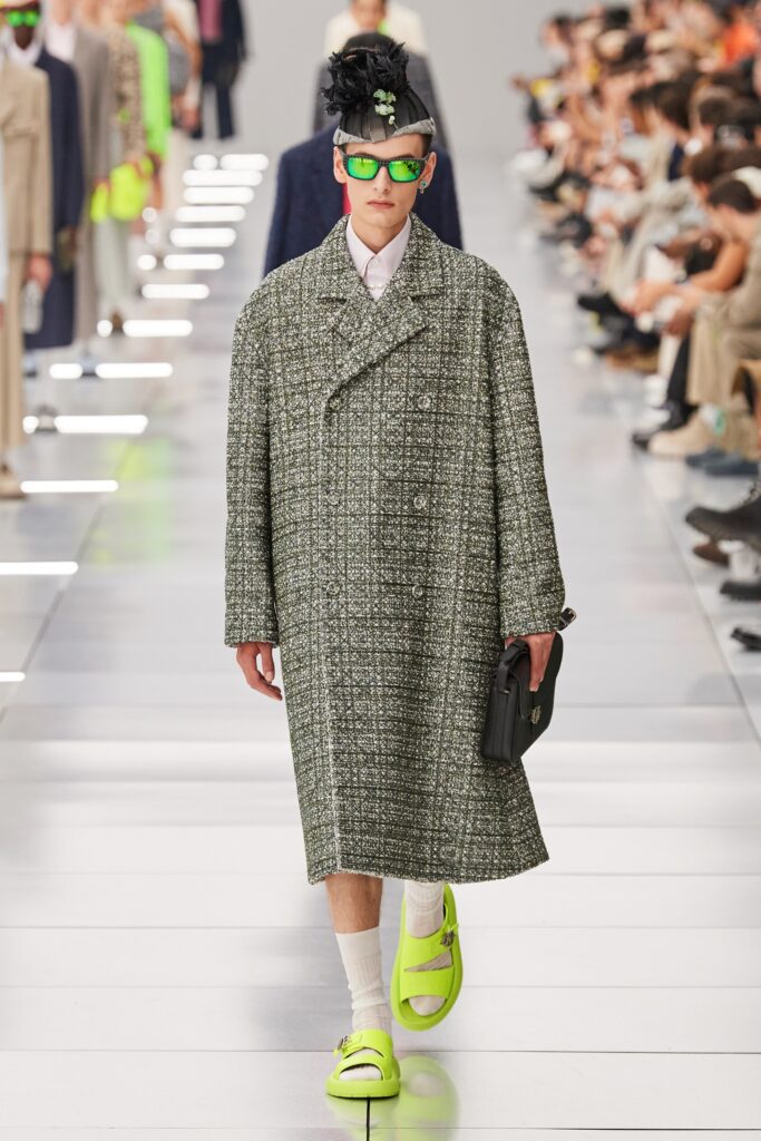 An oversized gray wool coat with long sleeves and a double-breasted design.