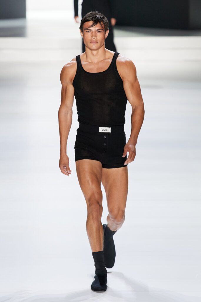 A fitted black cotton tank-top paired with matching fitted shorts for a sleek look.