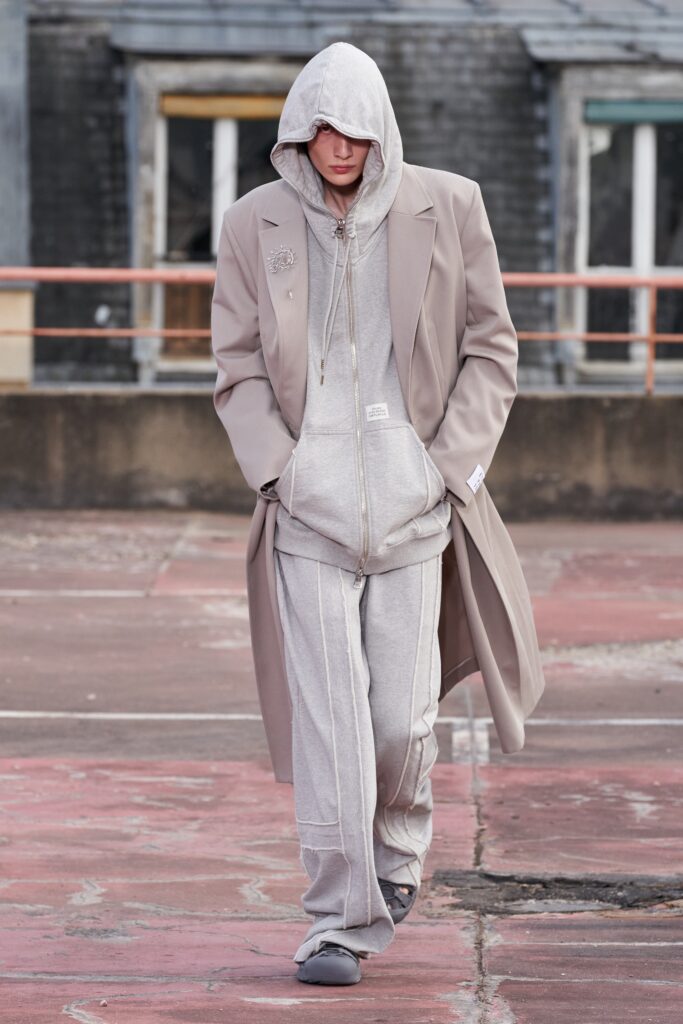 beige coat gray hoodie pants