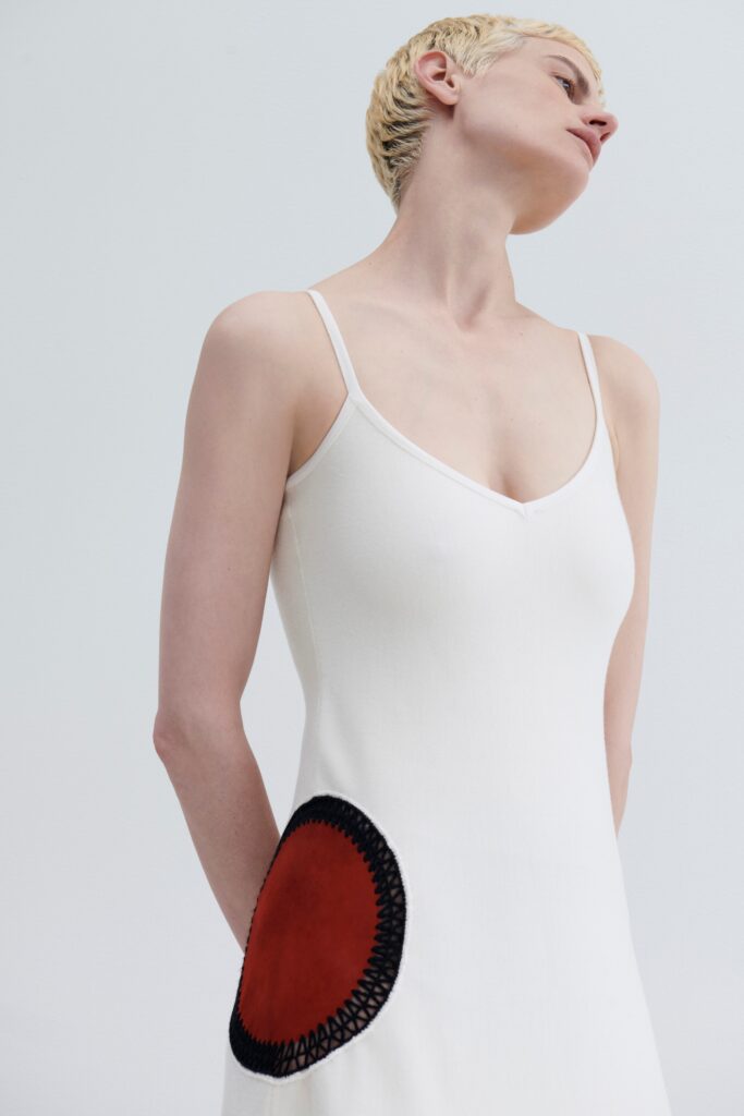 fitted white sleeveless dress