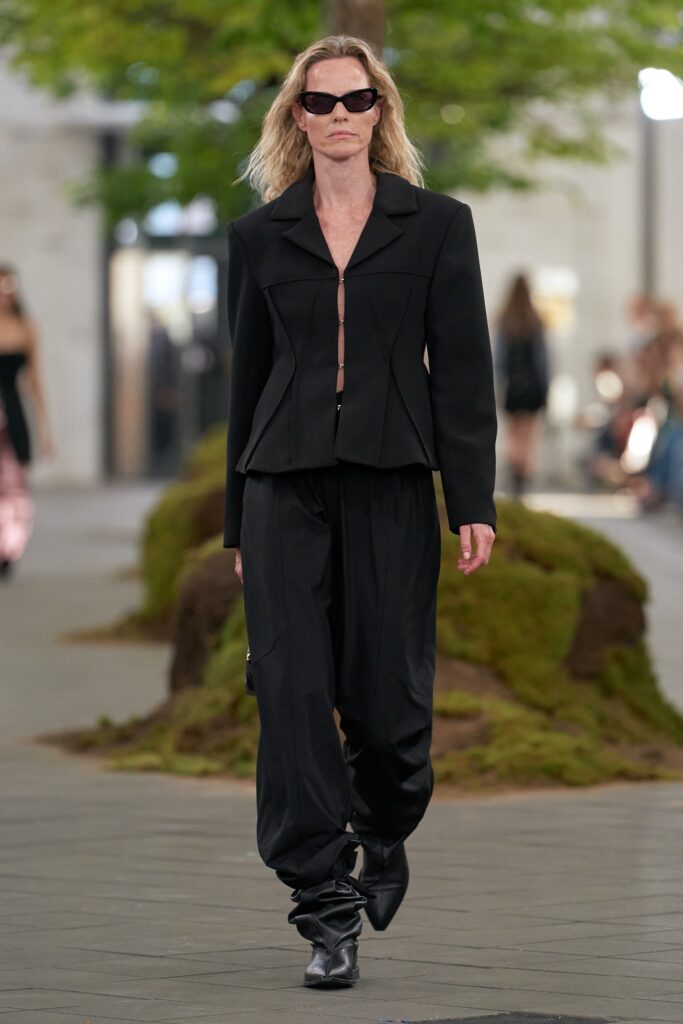 black fitted jacket and relaxed pants