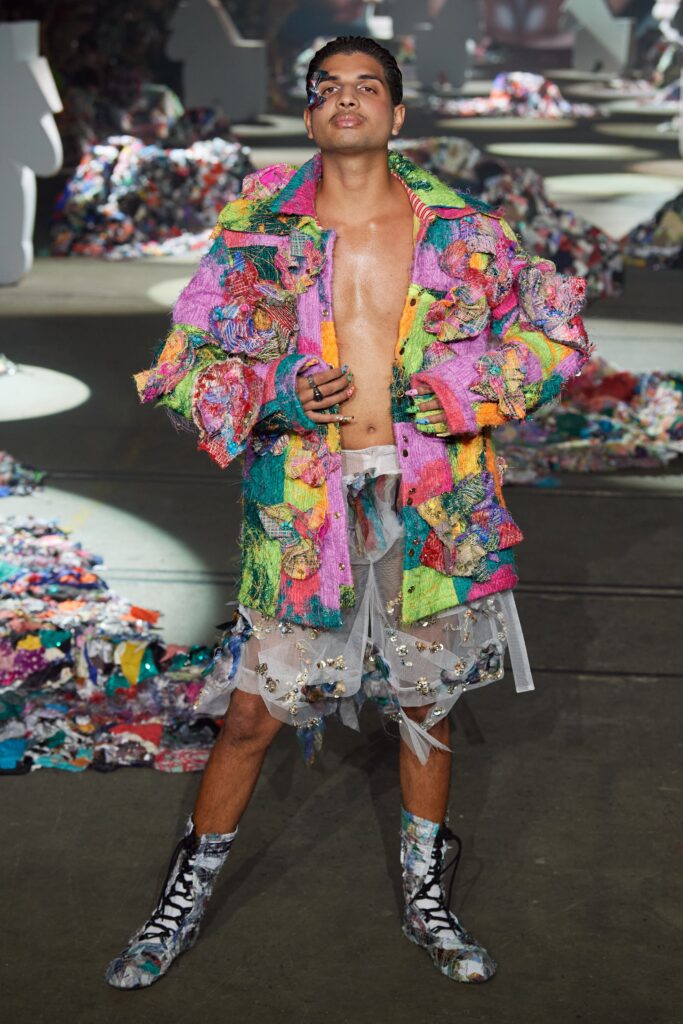 A relaxed multicolor jacket with long sleeves and a layered skirt, showcasing a unique design.