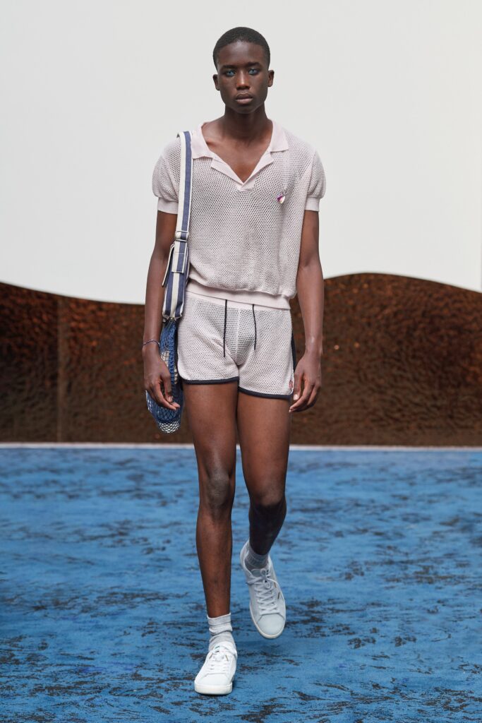 A fitted pink striped shirt with short sleeves paired with matching shorts.