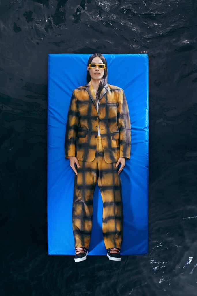A relaxed yellow and brown checked suit with a collared long-sleeve shirt.