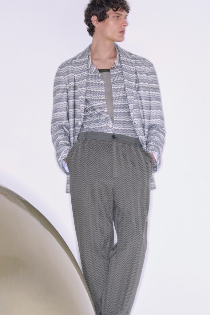 A relaxed gray striped jacket paired with wide-leg pants for a modern look.