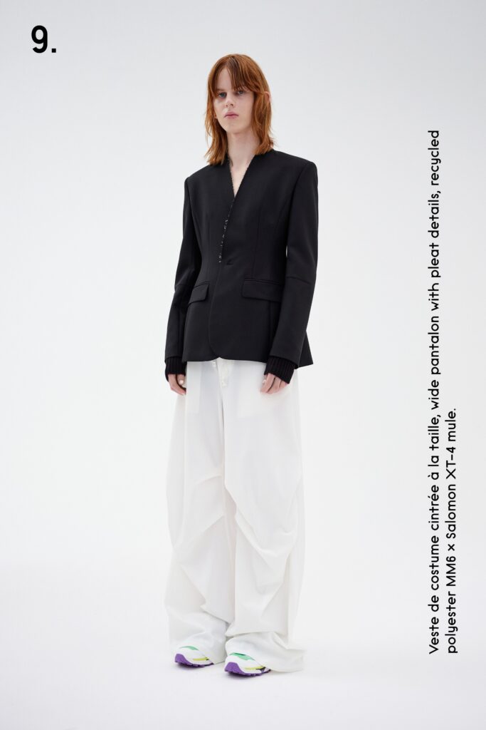 A relaxed black blazer paired with wide-leg white pants, featuring a collared design.
