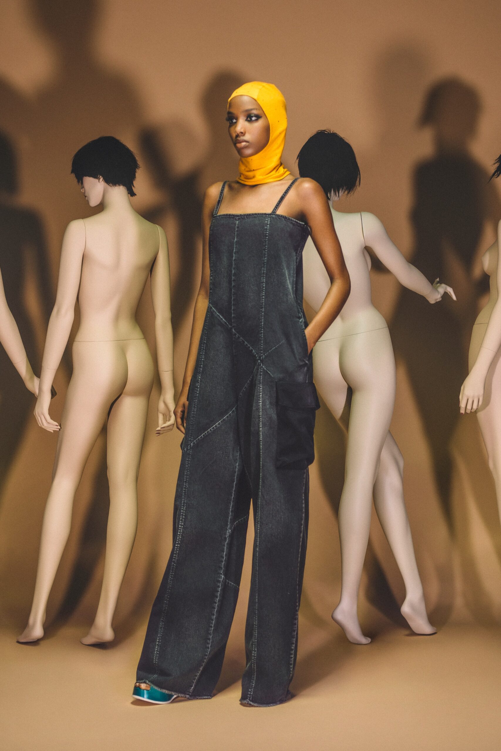 blue denim relaxed jumpsuit with yellow headscarf