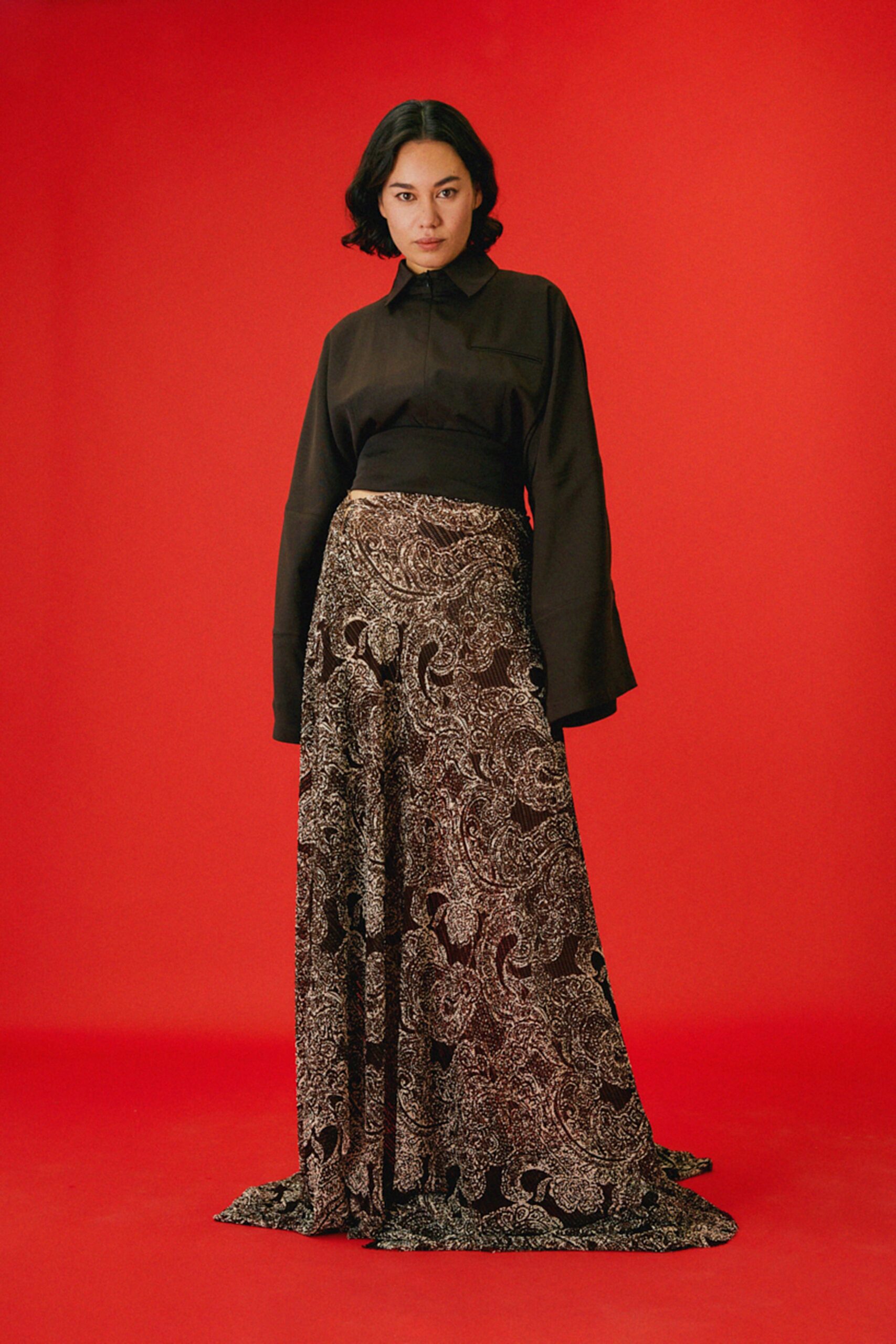 black blouse and brown flared skirt