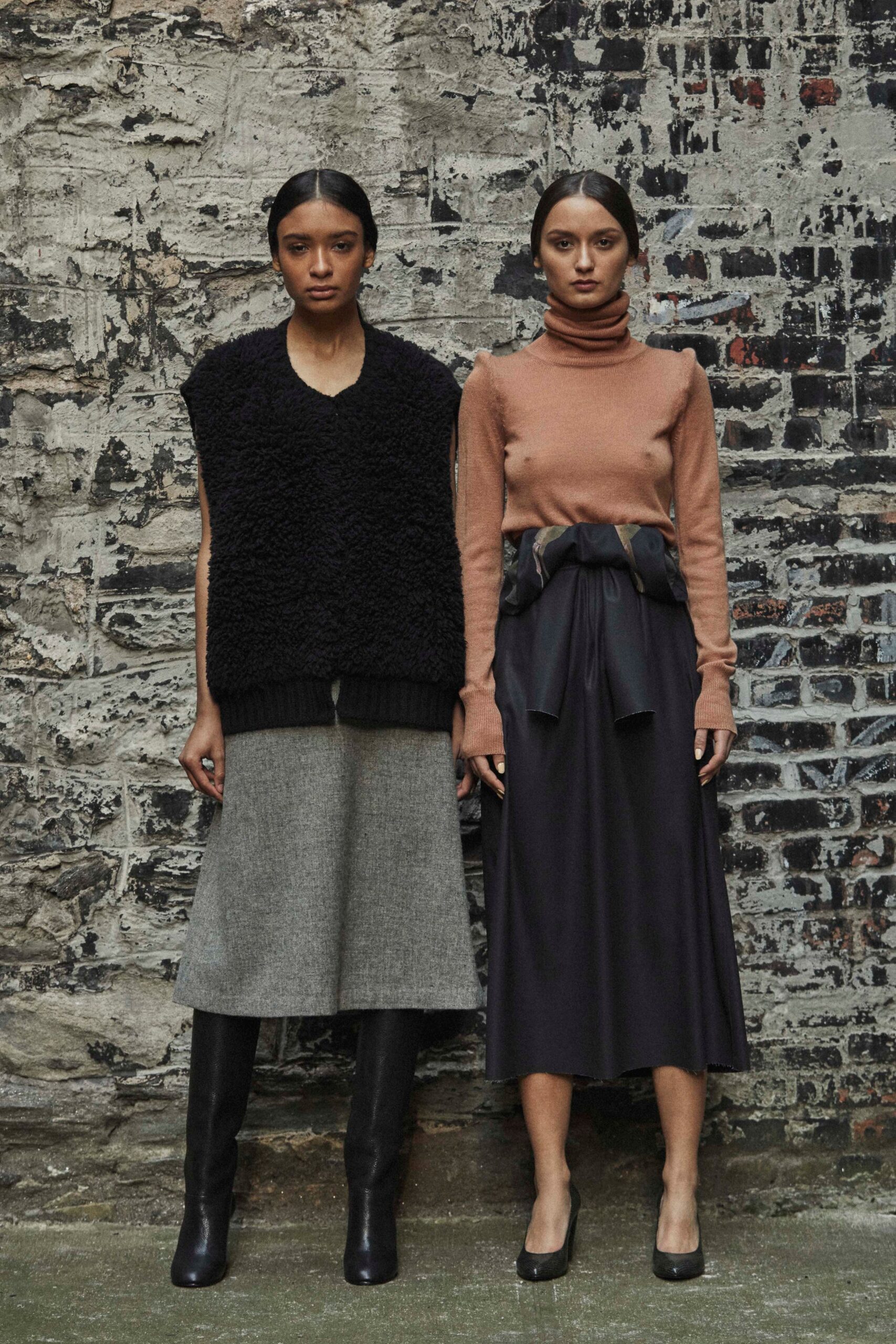 black faux-fur vest and brown turtleneck