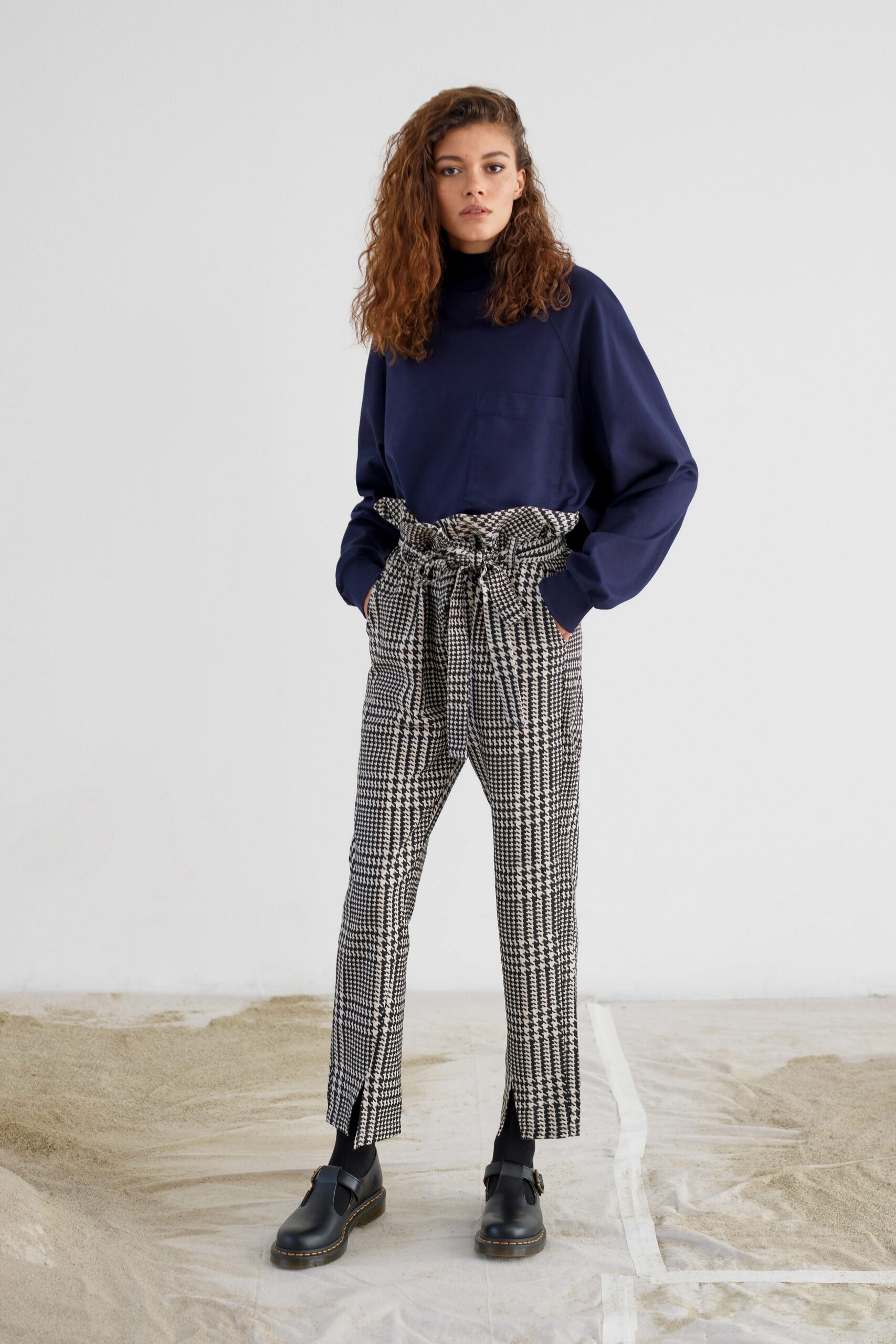 blue oversized top with checked pants