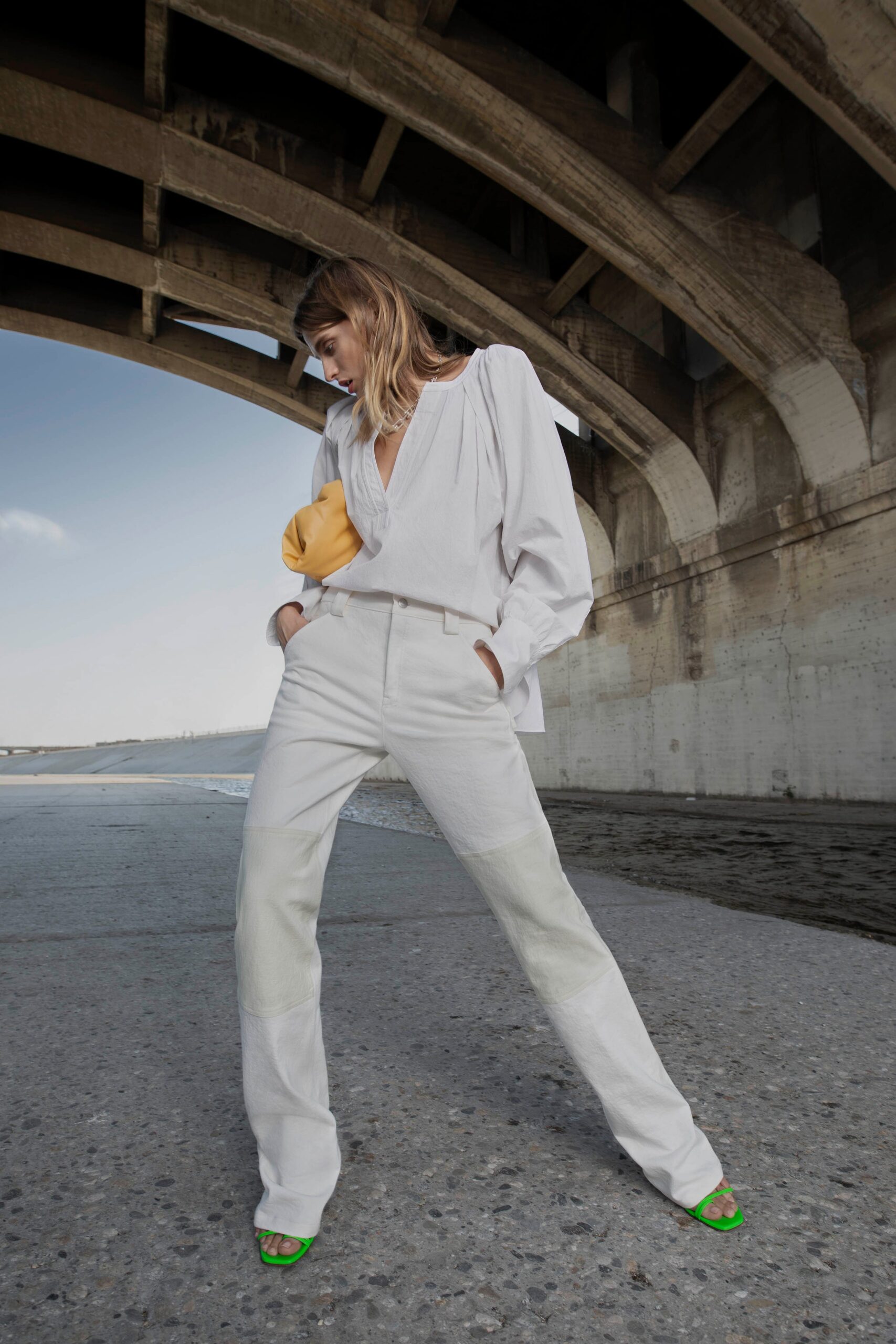 white relaxed blouse and fitted pants