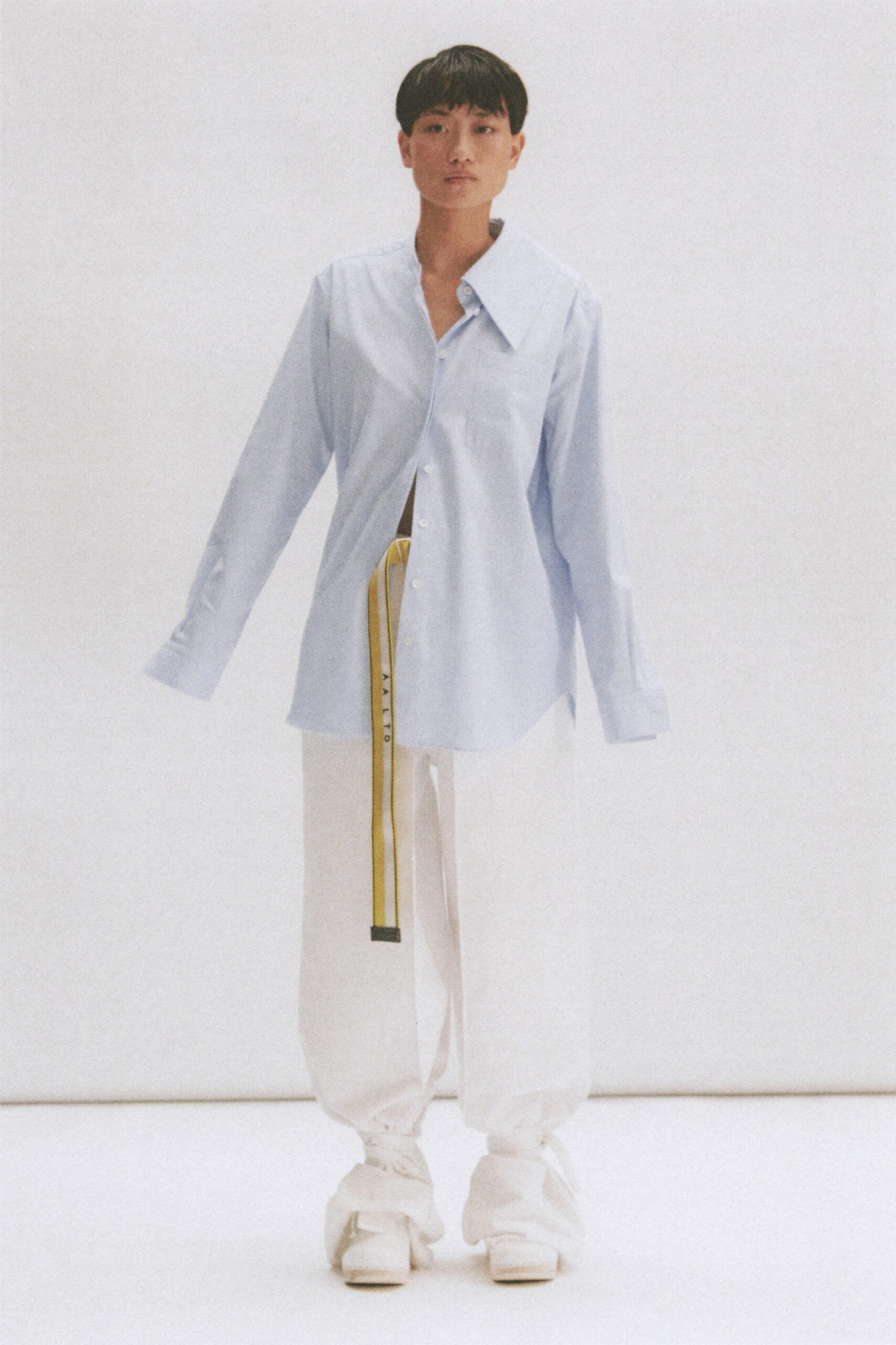 blue relaxed shirt with white pants