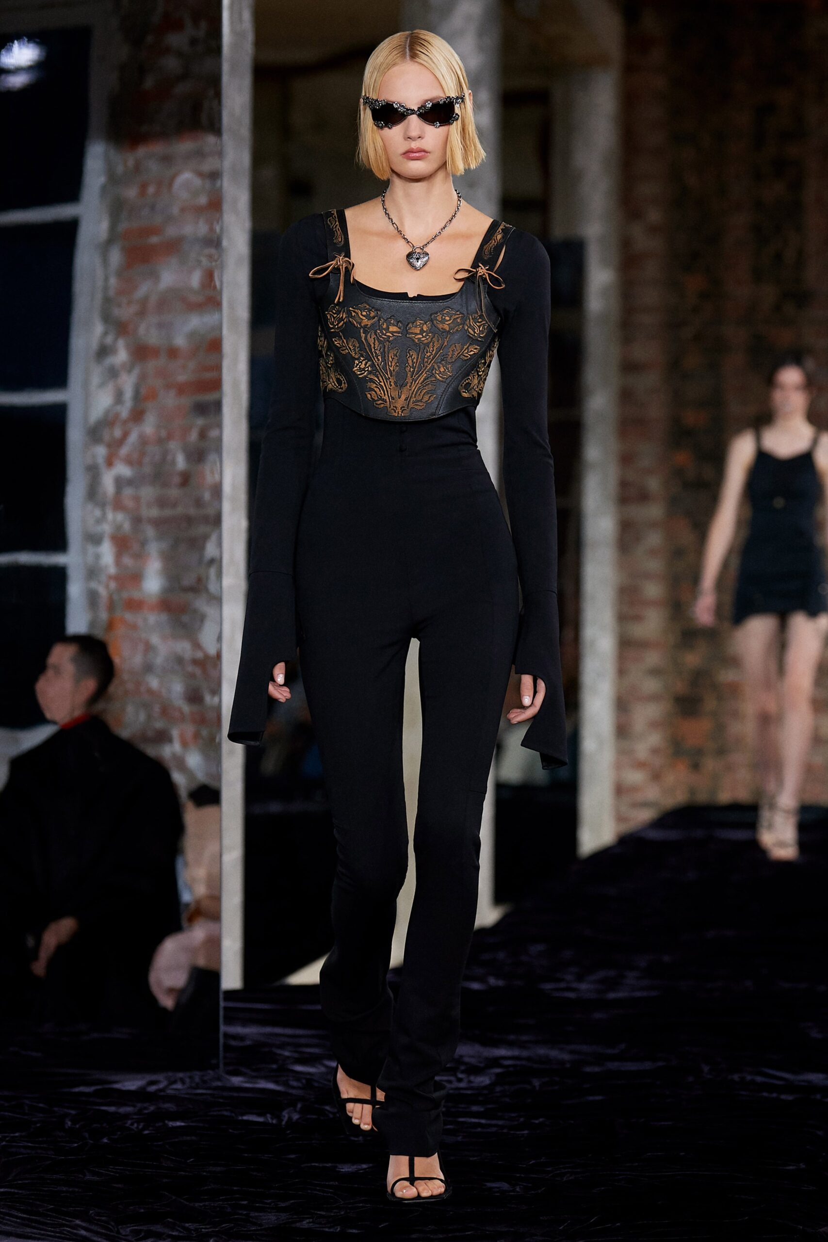 black fitted catsuit with embellishments