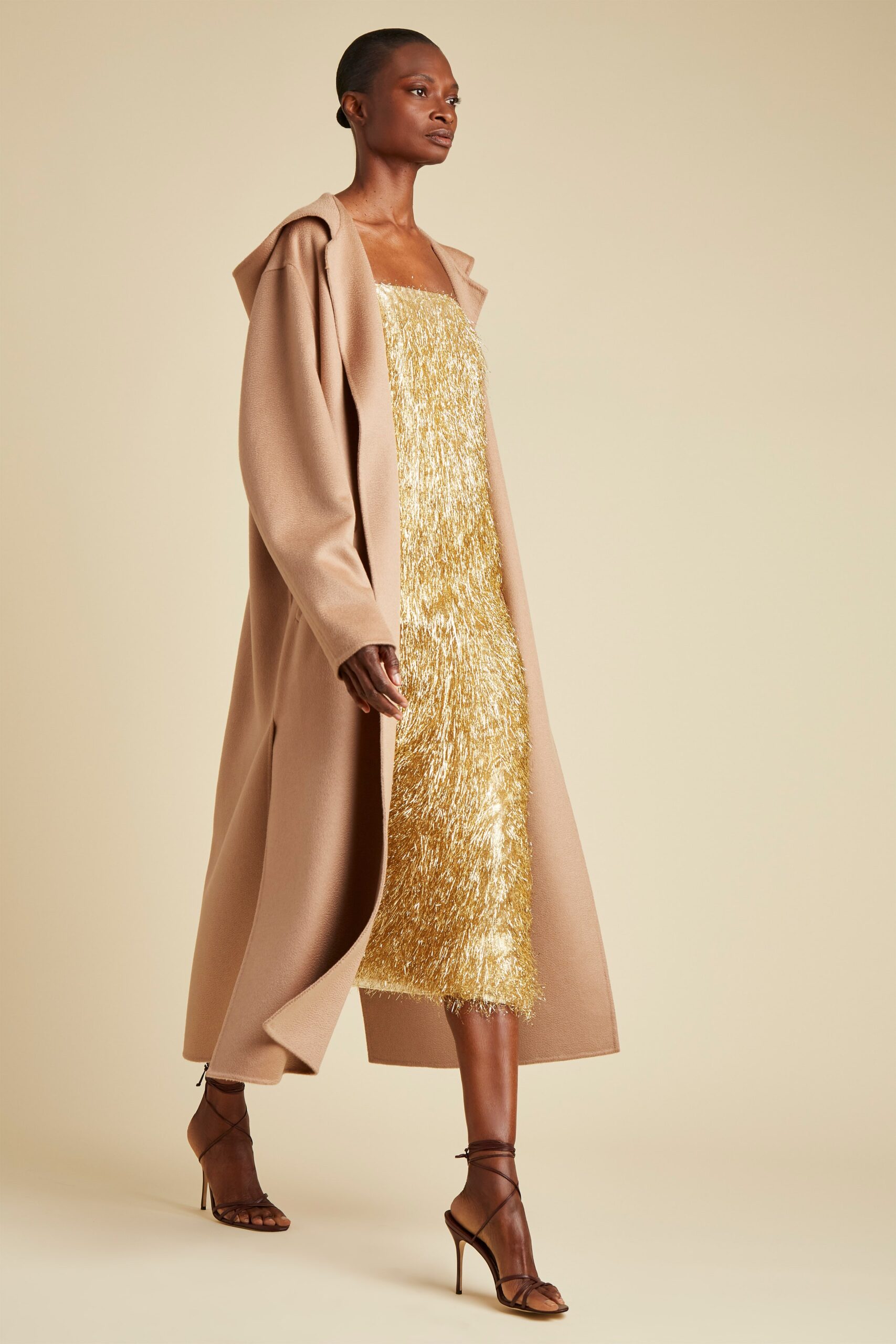 beige wool coat gold fringed dress