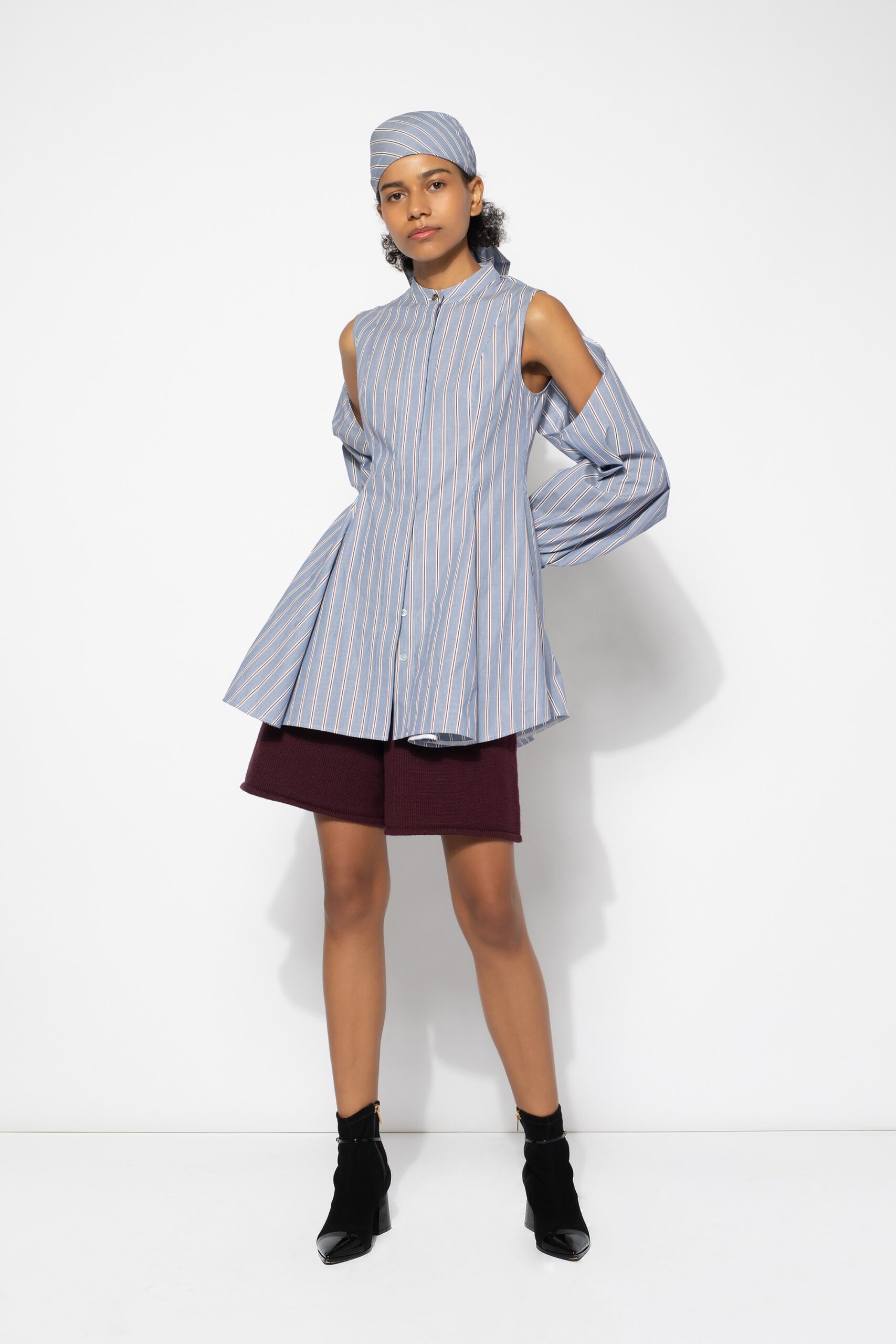 blue striped top with maroon shorts