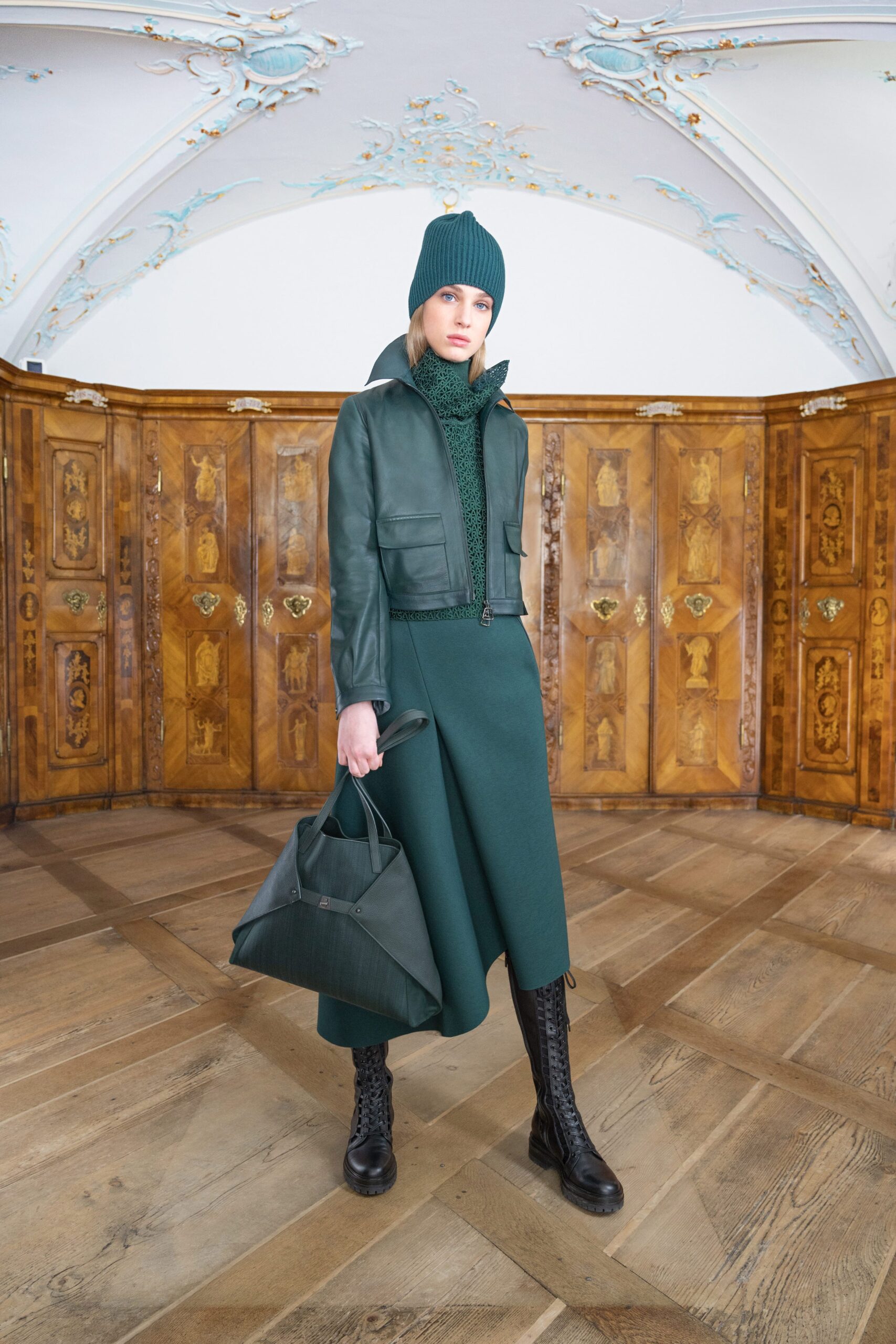 green leather jacket and midi skirt