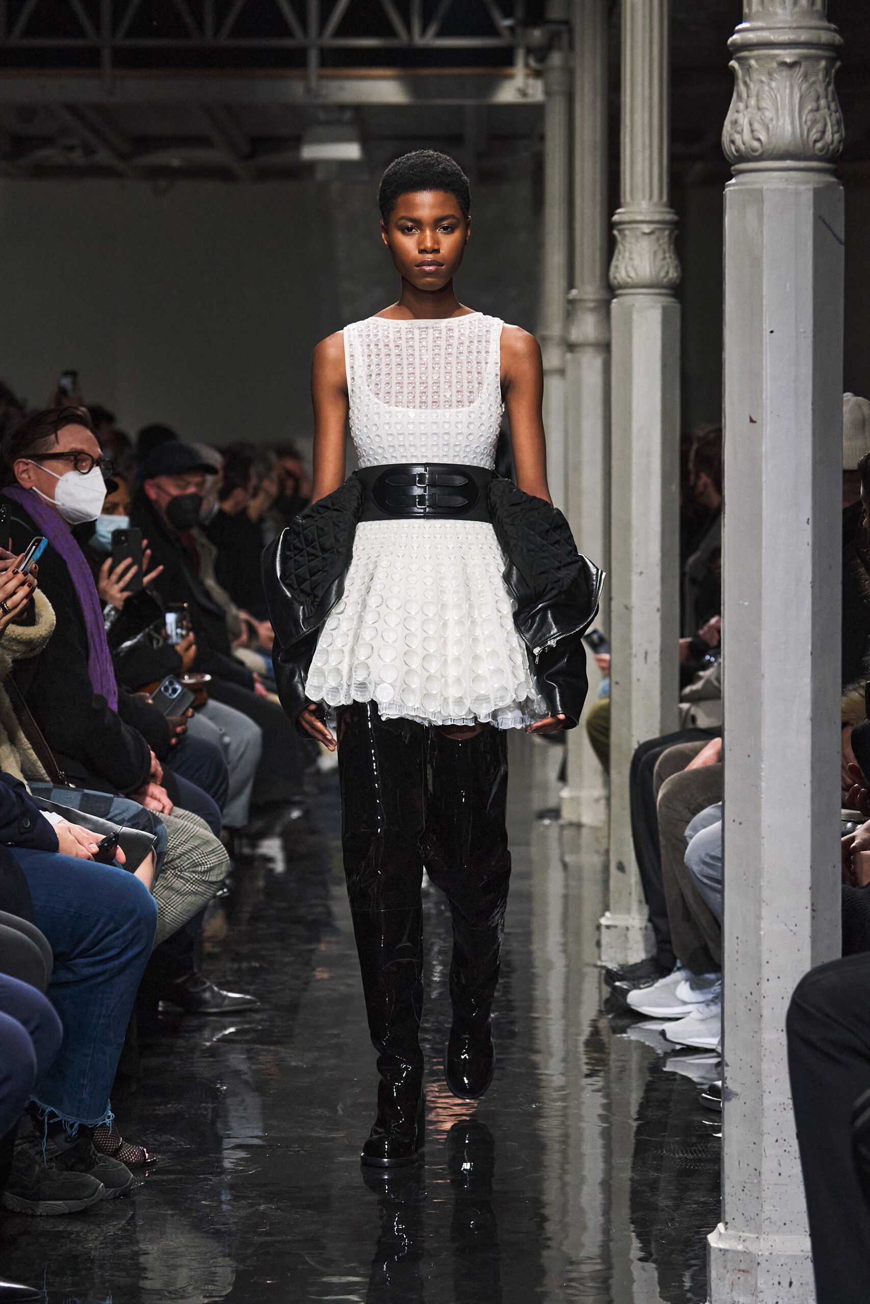 white pleated mini dress with black coat