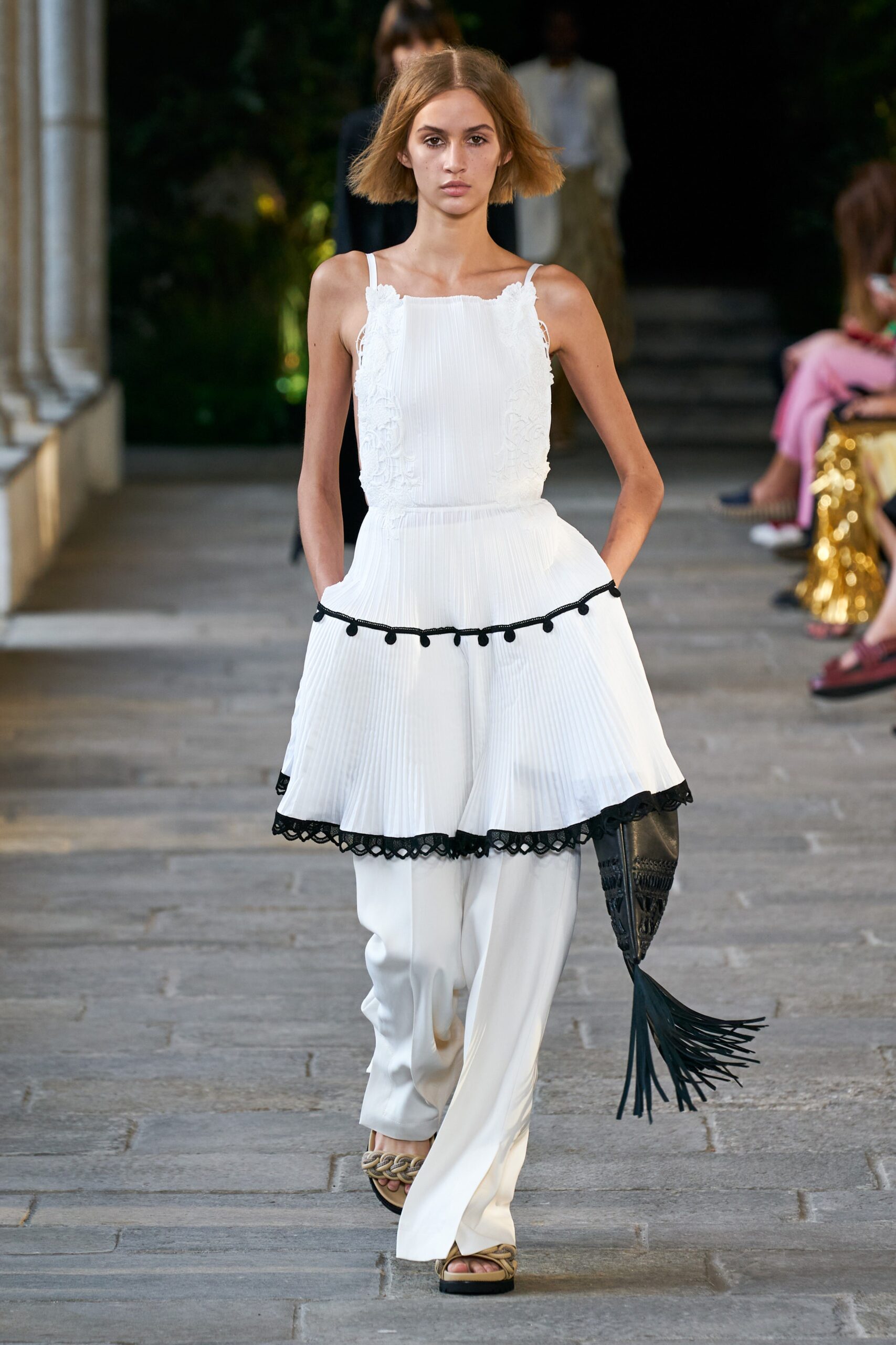 white pleated top with relaxed pants