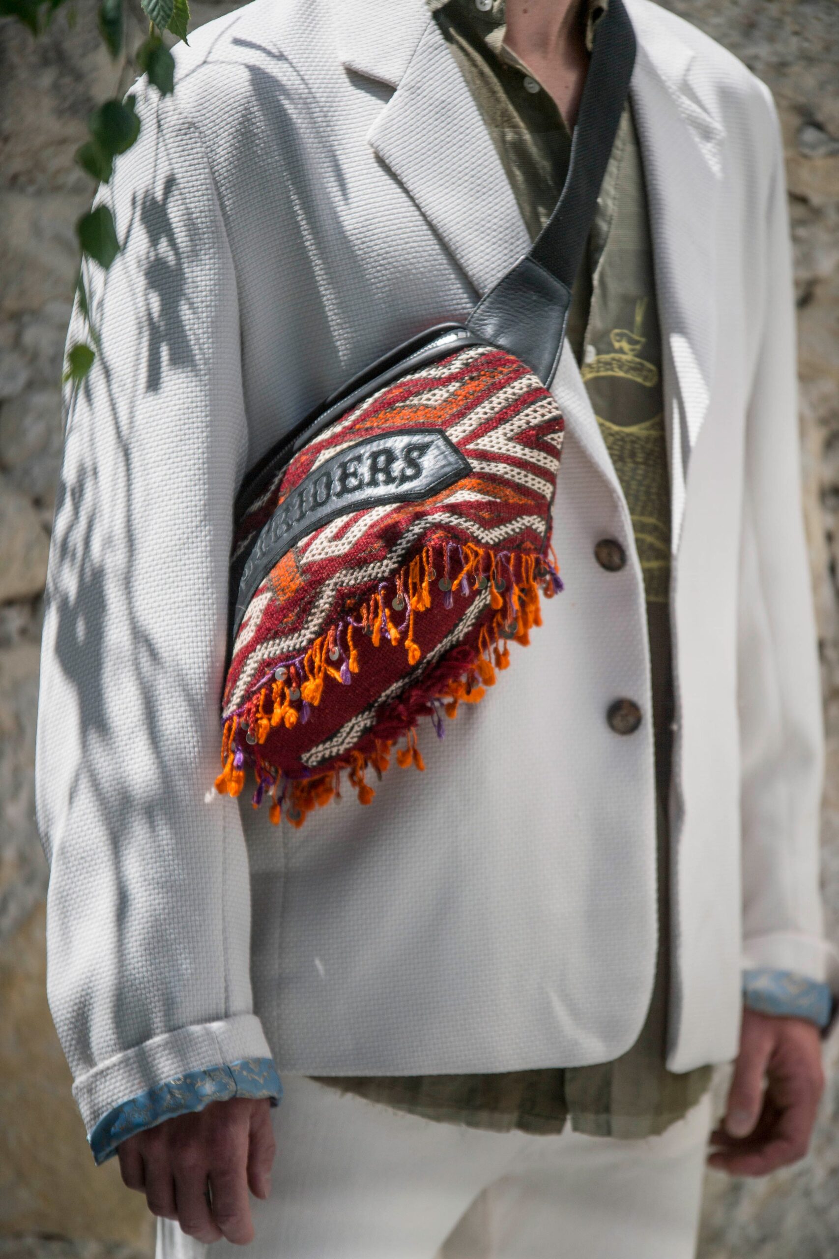 white tailored blazer with multi bag