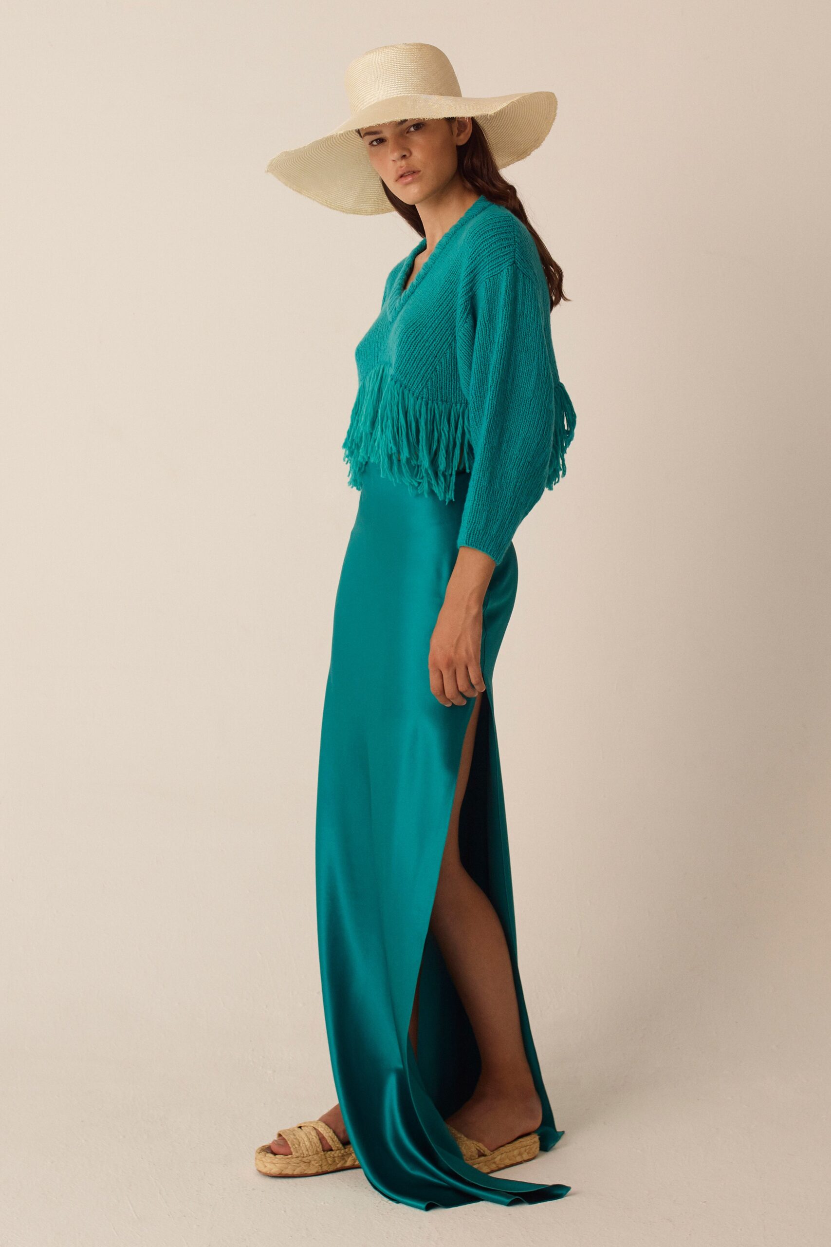 teal sweater and blue gown