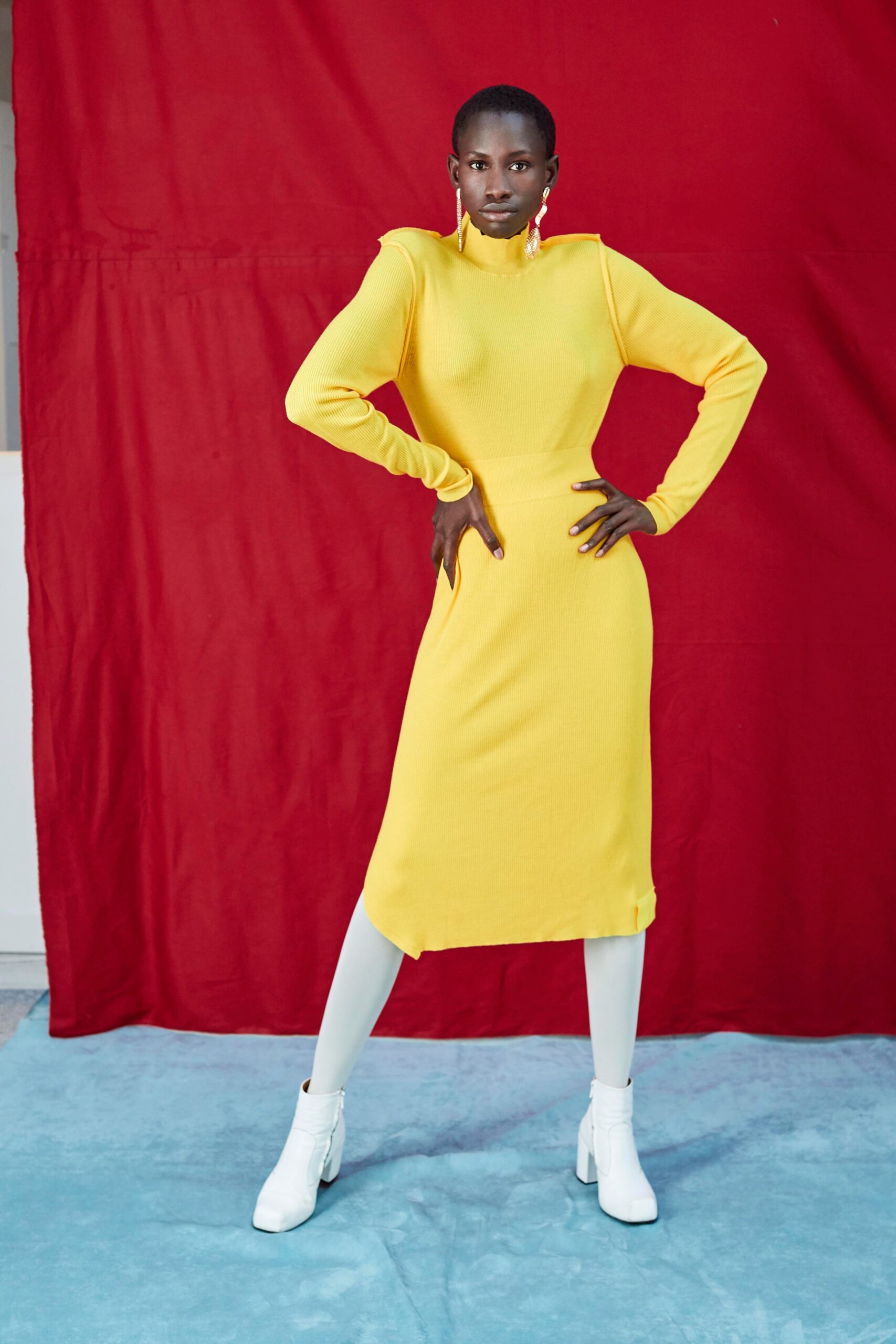 fitted yellow midi dress with white boots
