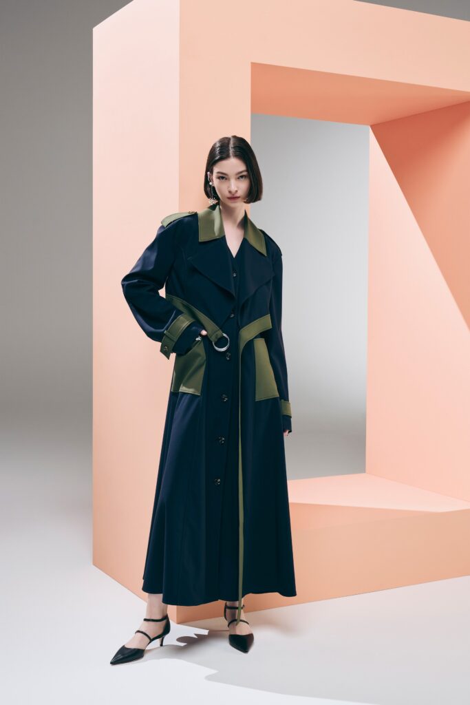 A relaxed navy and green long-sleeve dress with a collared neckline and buttoned front.