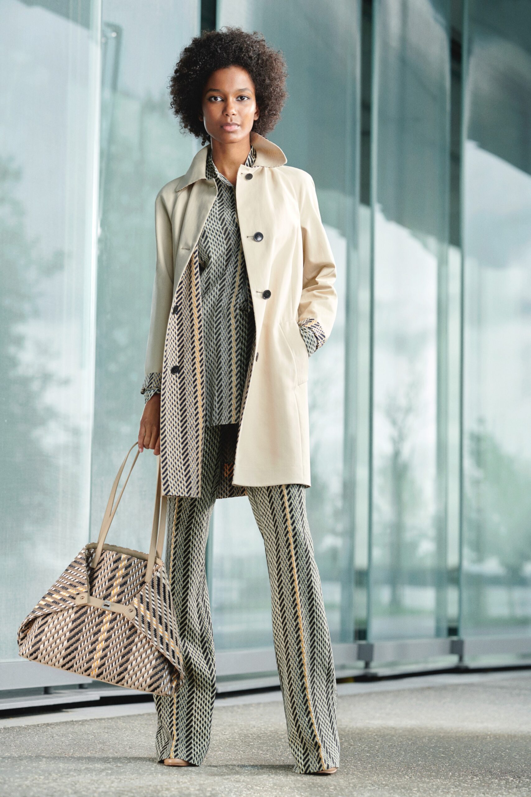 beige coat with printed top and pants