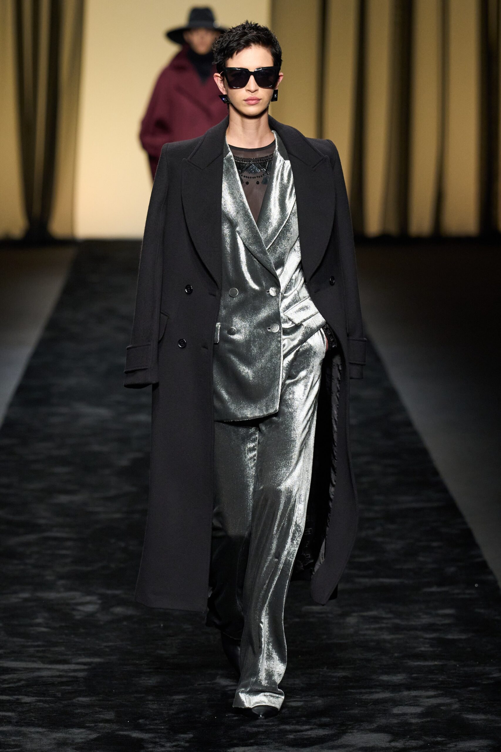 black coat and silver suit