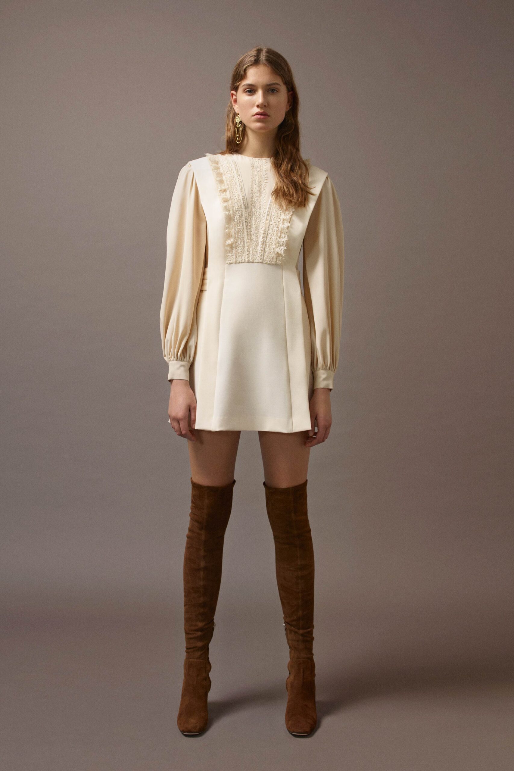 ivory pleated mini dress with brown boots