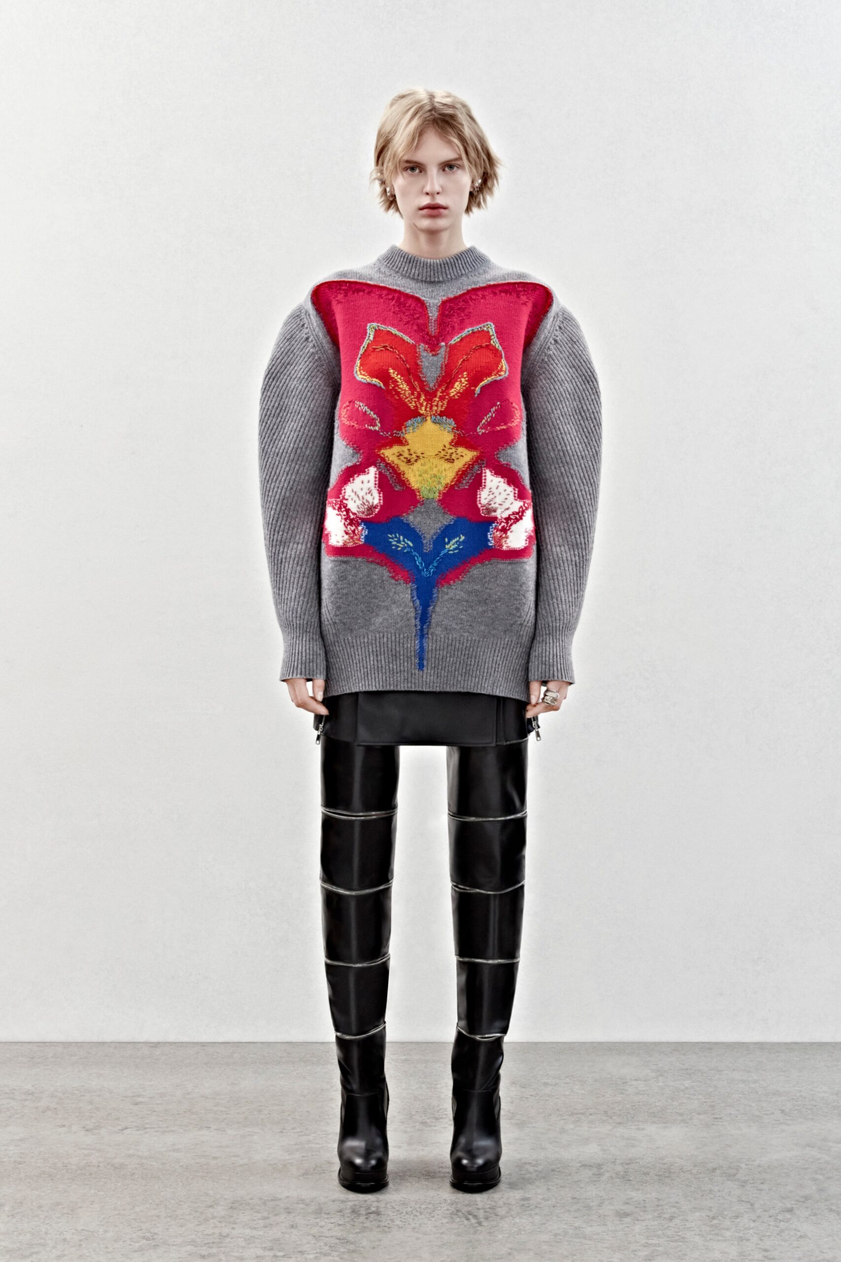 oversized gray embroidered sweater with fitted pants