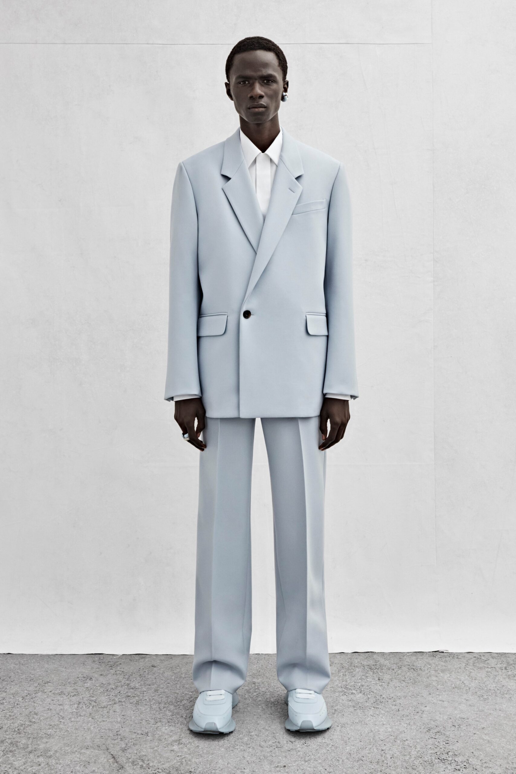 blue tailored suit with white shirt