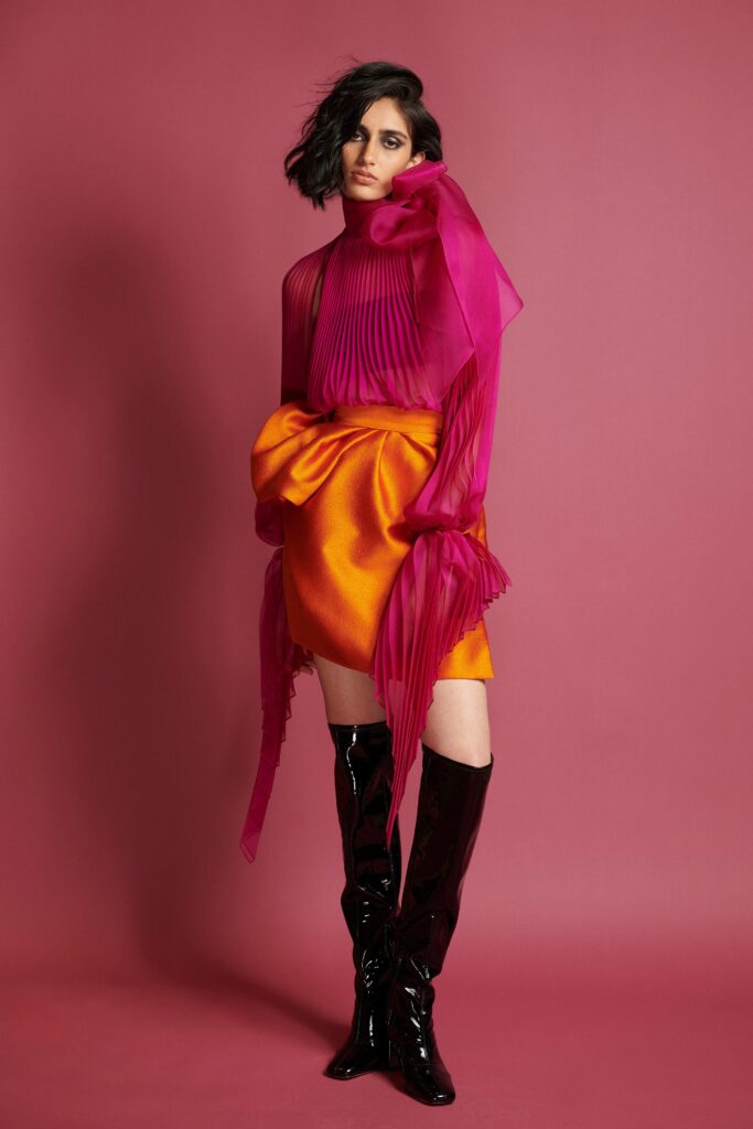 pink pleated top orange skirt