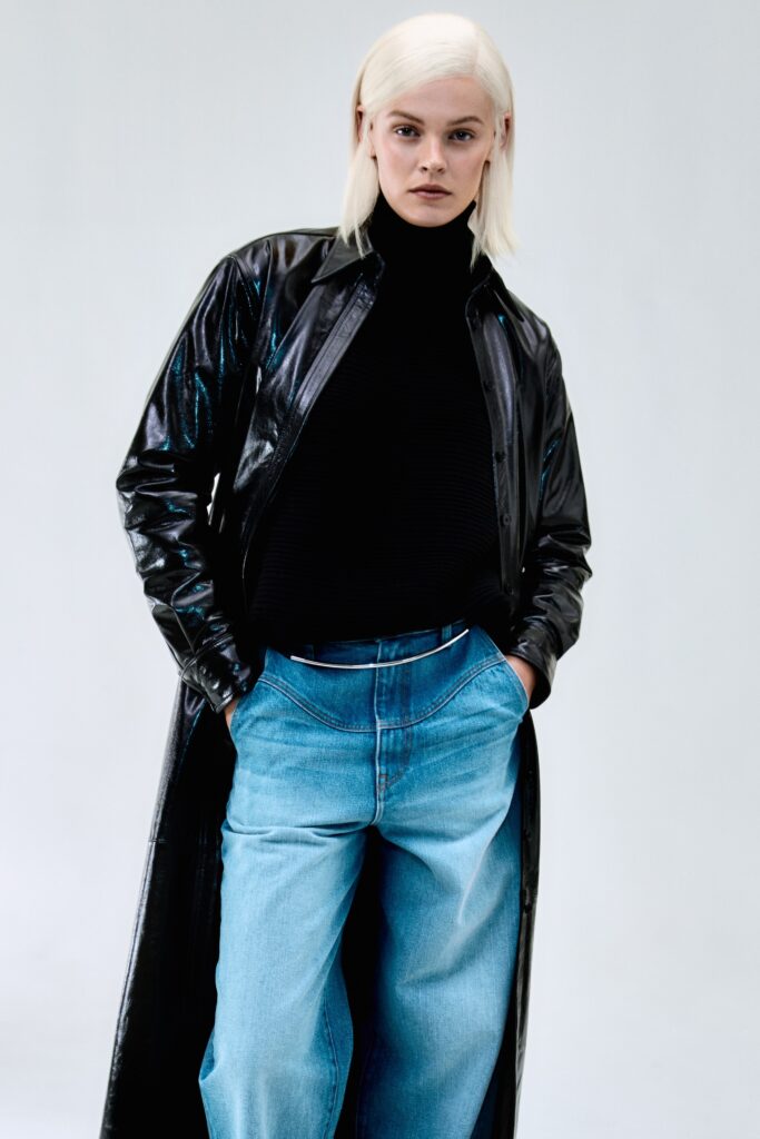 black vinyl coat with denim pants