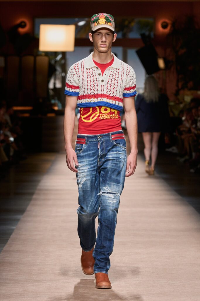 A fitted red striped short-sleeve shirt paired with distressed blue jeans.