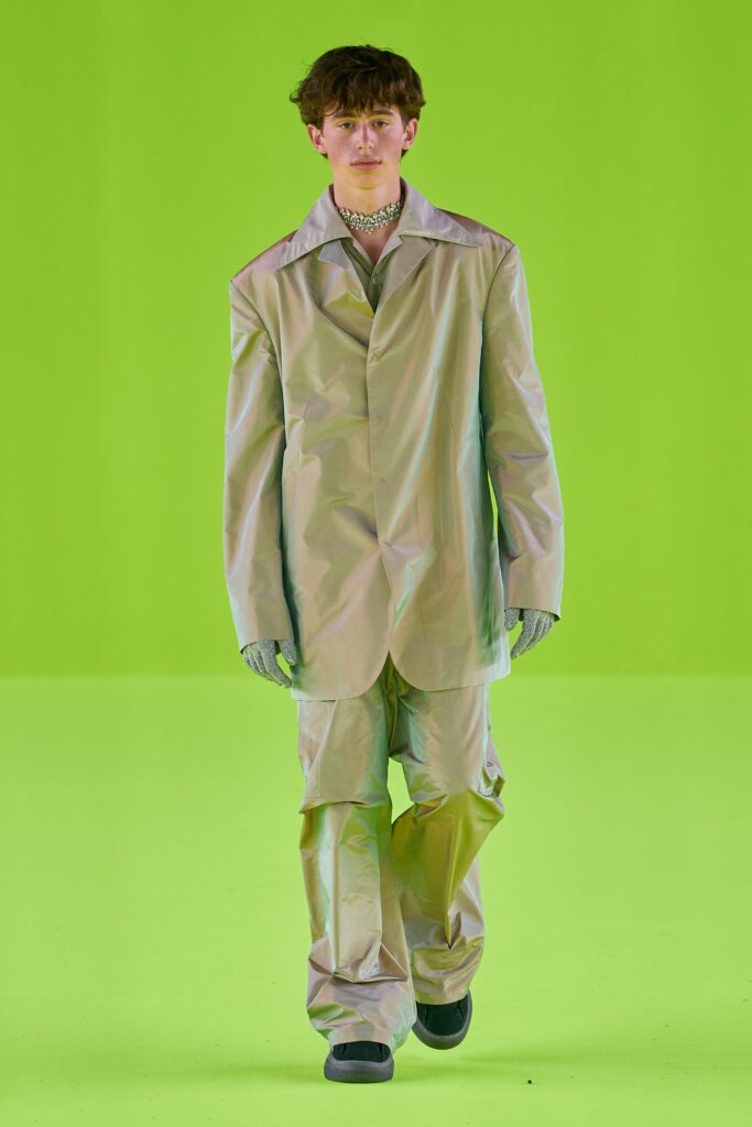 A relaxed silver metallic suit with long sleeves and a collared design.