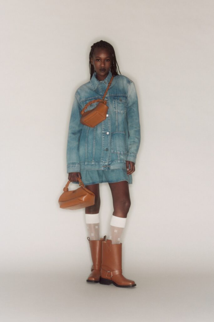 A fitted blue denim dress with a collared long-sleeve jacket design and mini length.