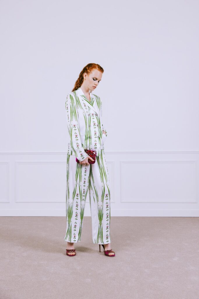 A relaxed fit white and green printed shirt paired with matching pants.