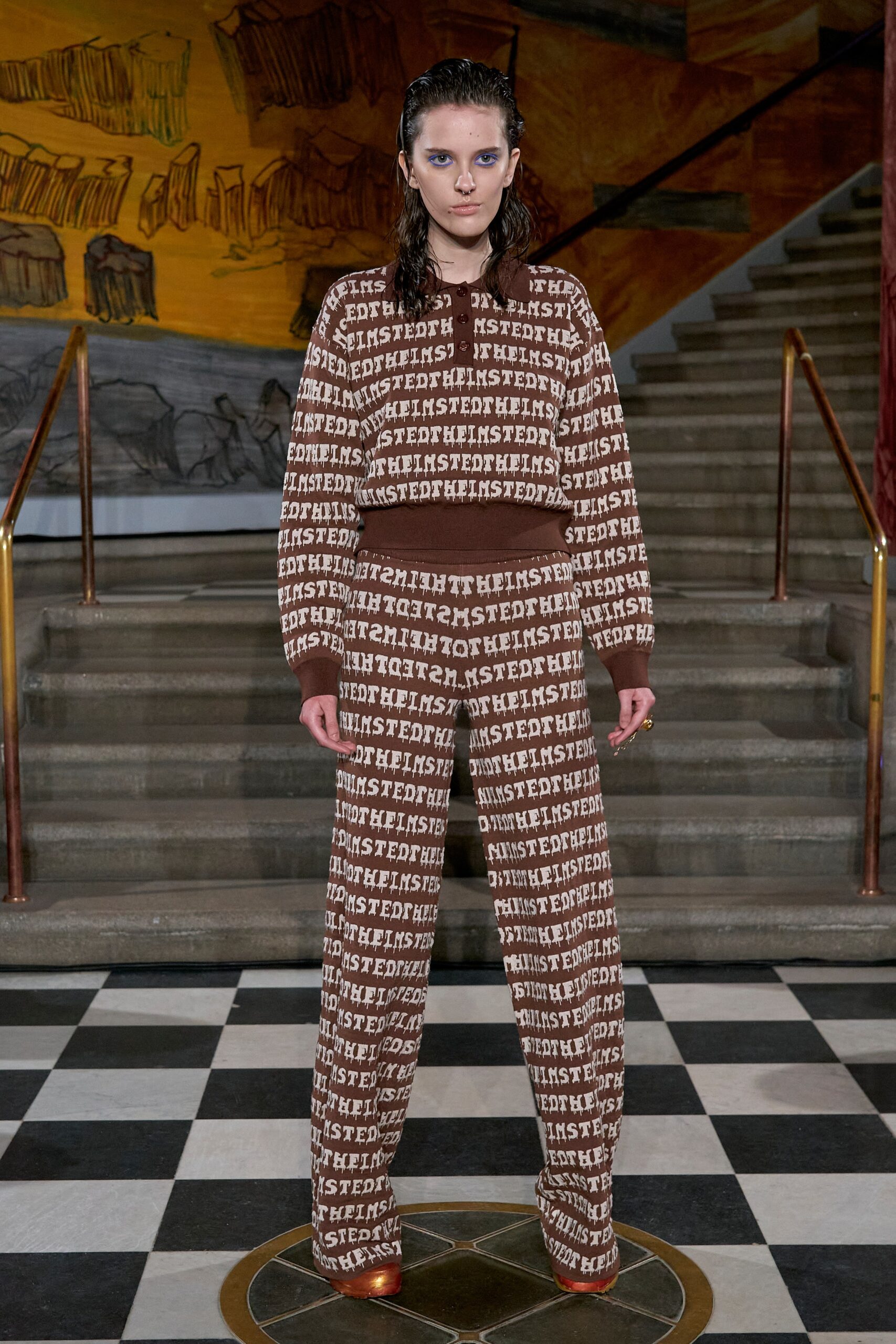 A relaxed brown printed sweater paired with matching pants, featuring long sleeves and a collared design.