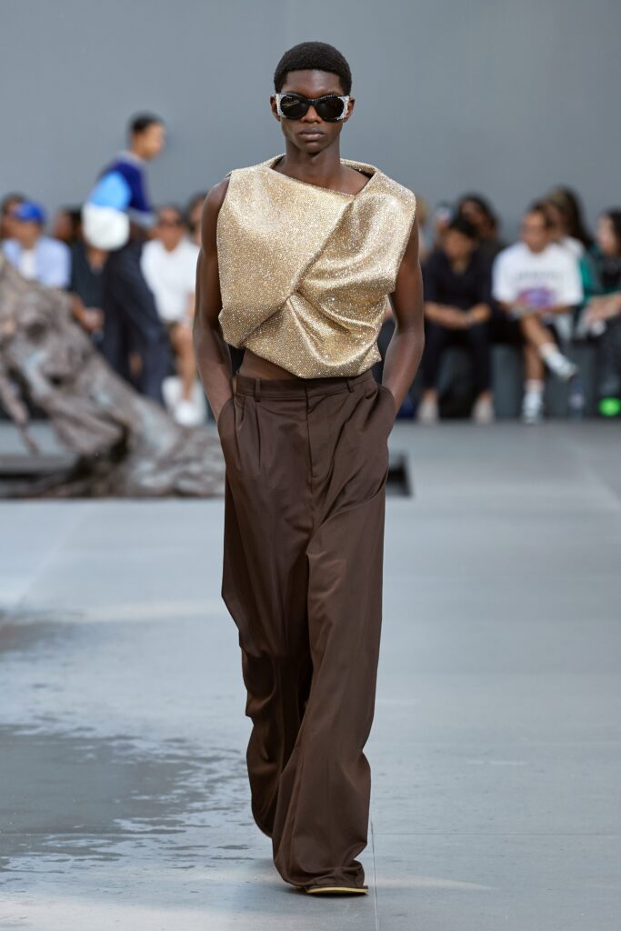 gold draped top and brown wide-leg pants