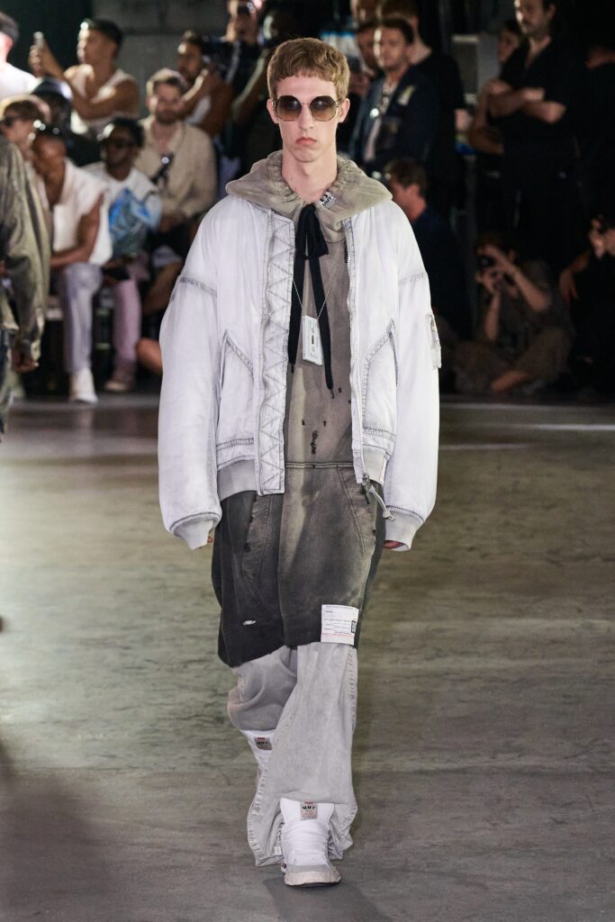 A relaxed gray denim jacket paired with matching pants, featuring a layered design.