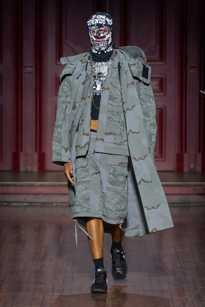 A relaxed gray coat with long sleeves and a collared design, paired with matching shorts.