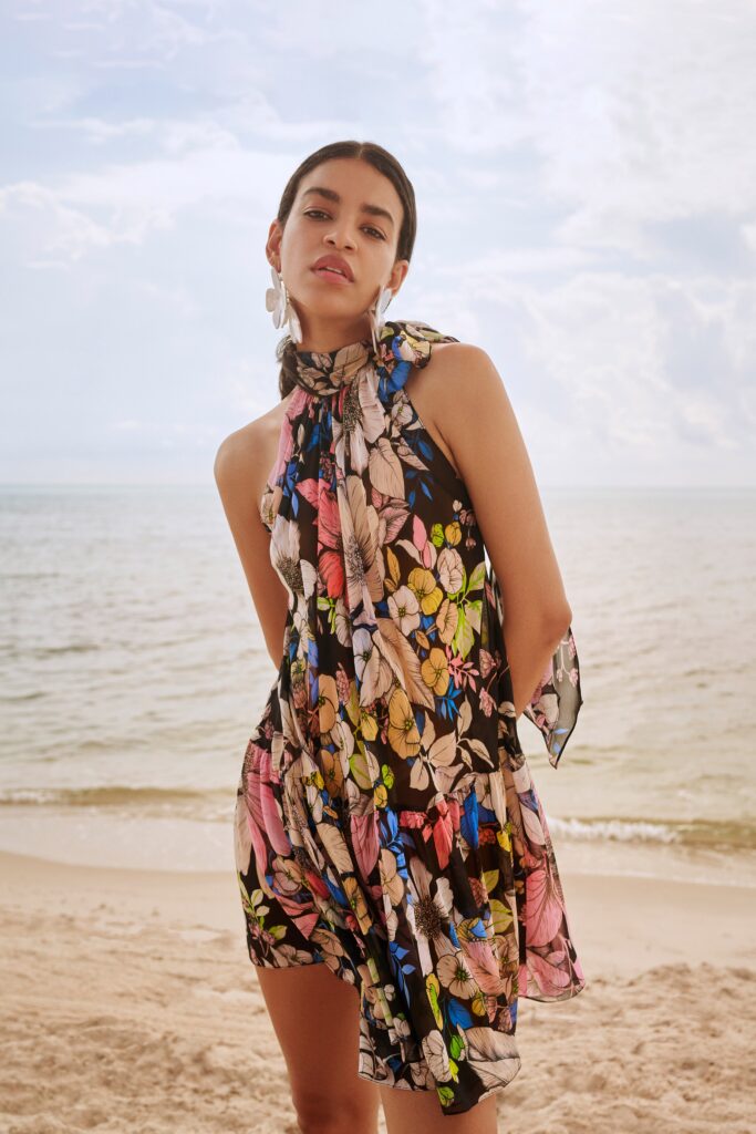 A relaxed multicolor chiffon sleeveless dress with a high neckline and flared silhouette.
