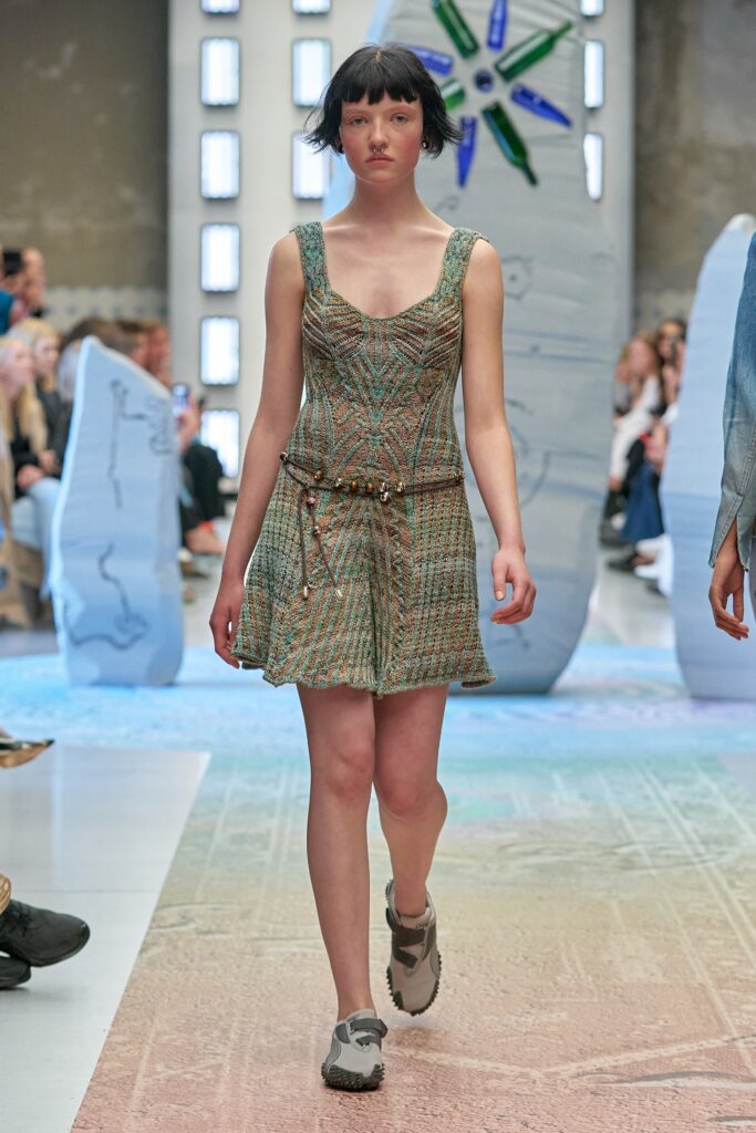 A relaxed multicolor sleeveless dress with a V-neckline and tiered design.