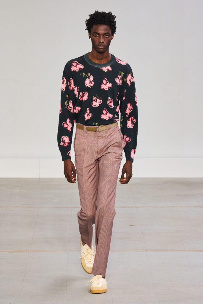 A relaxed-fit blue printed sweater paired with stylish pants, perfect for casual outings.