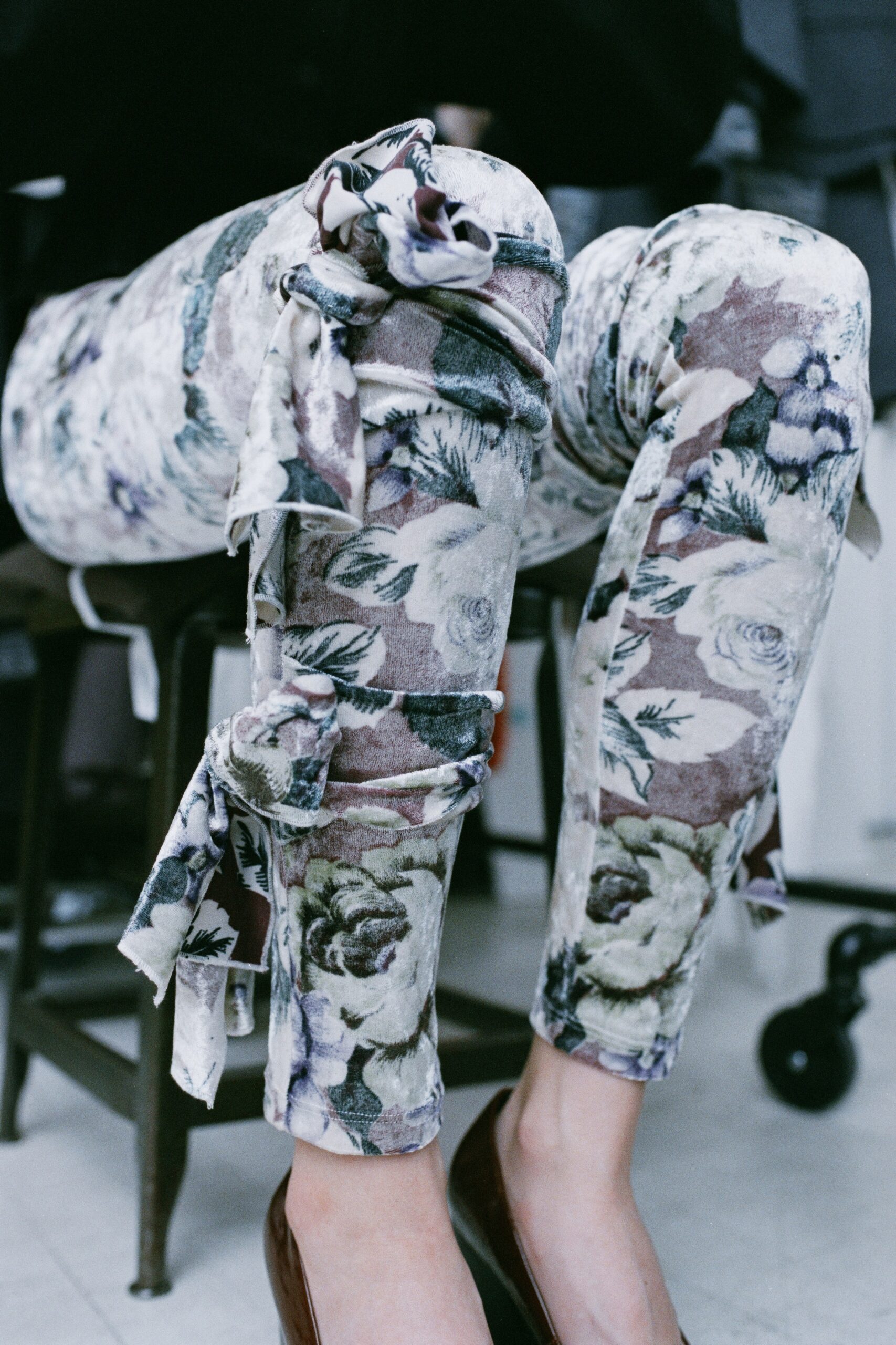 Fitted multicolor floral pants with unique detailing for a stylish look.